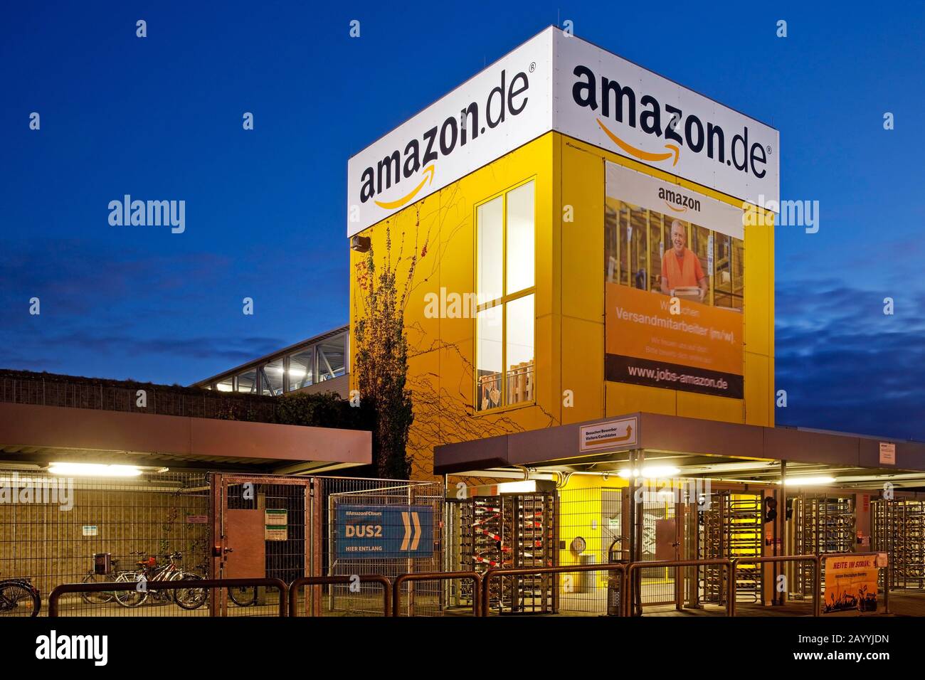 logistics centre of Amazon in the evening, one of the biggest Amazon sites in Europe, Germany, North Rhine-Westphalia, Ruhr Area, Rheinberg Stock Photo