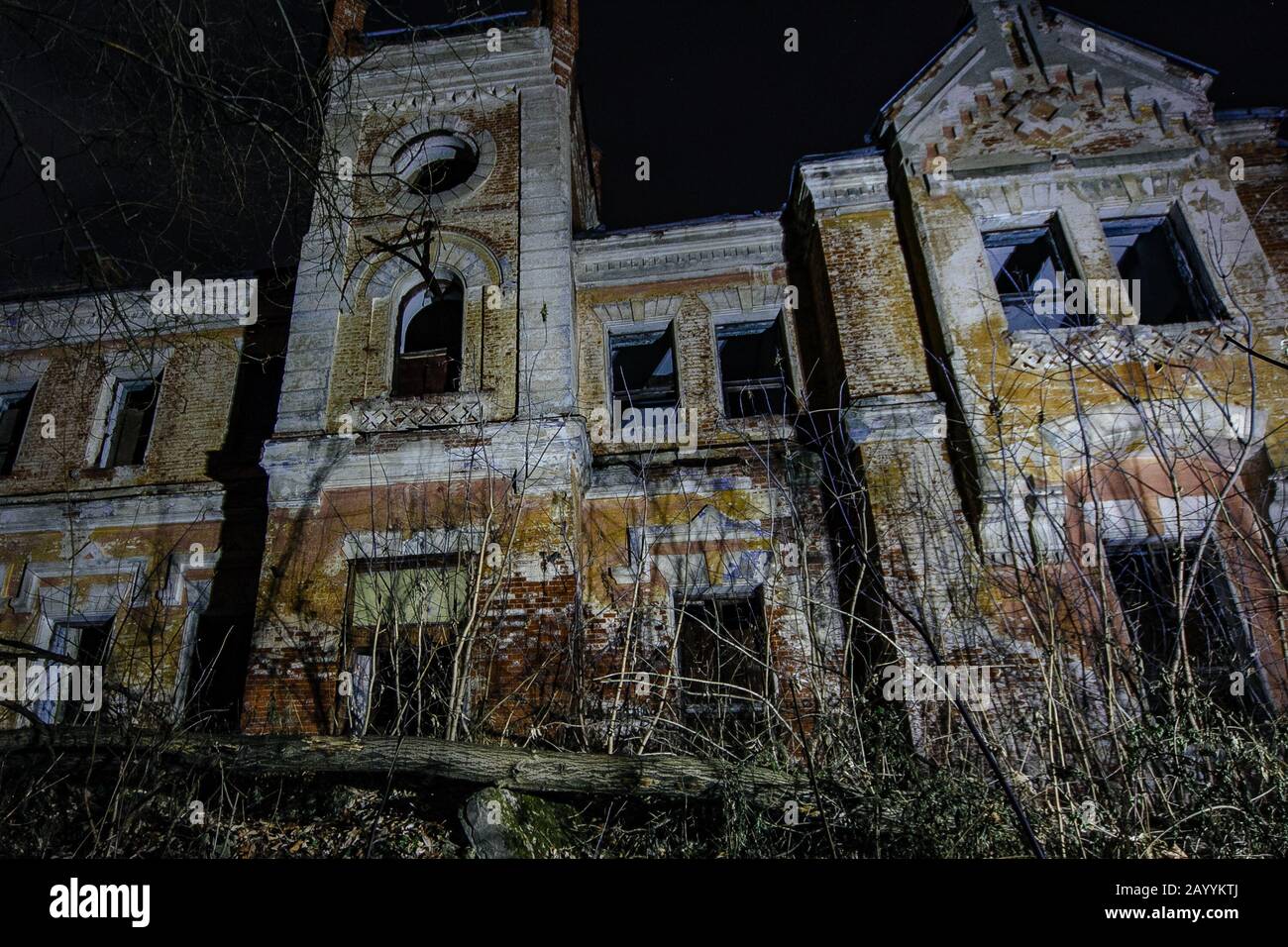 Dark and creepy old abandoned haunted mansion at night. Former Karl von