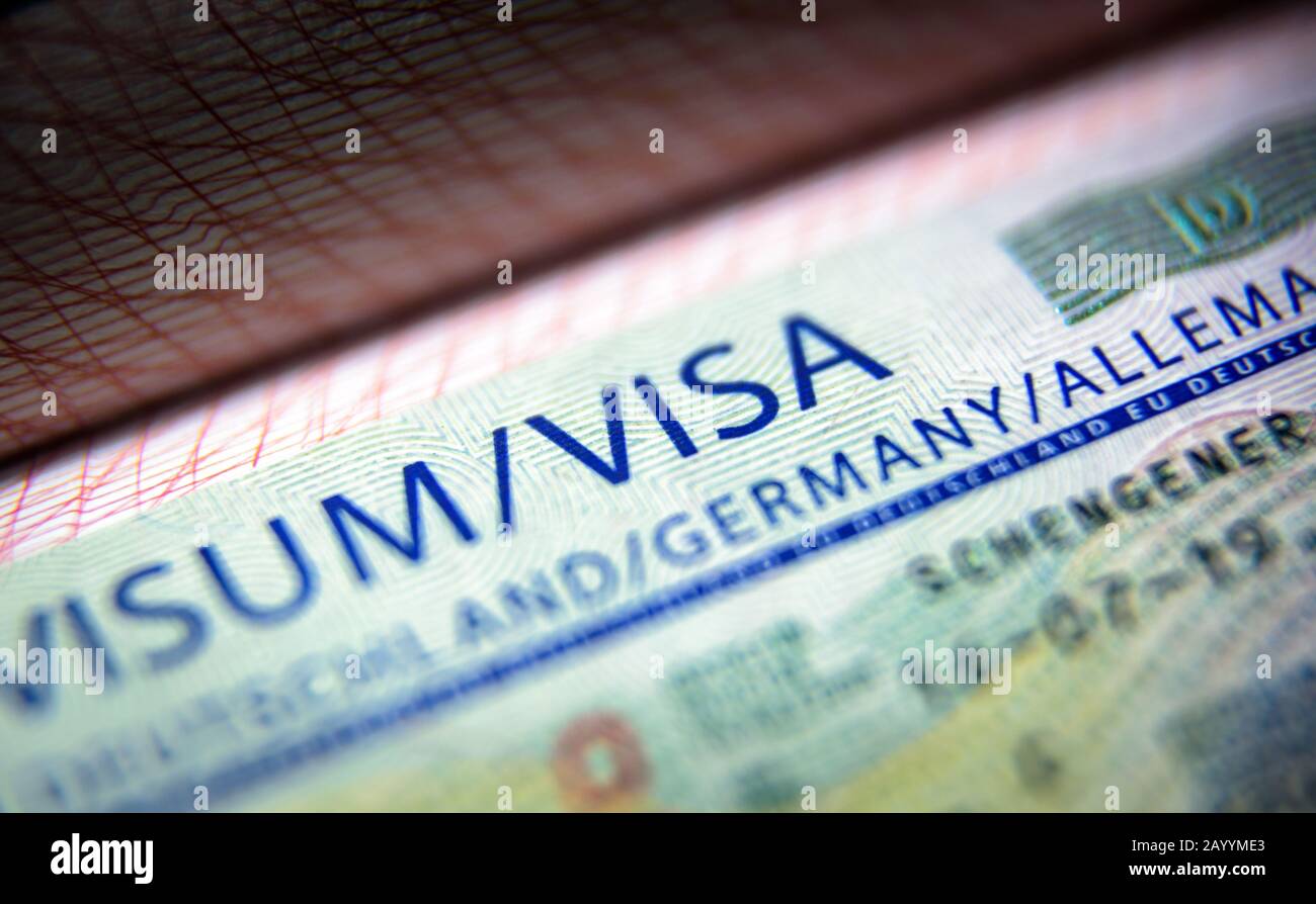 Visa stamp in passport close-up. German visitor visa at border control.  Document for multiple entry. Macro view of Schengen visa for tourism and  trave Stock Photo - Alamy
