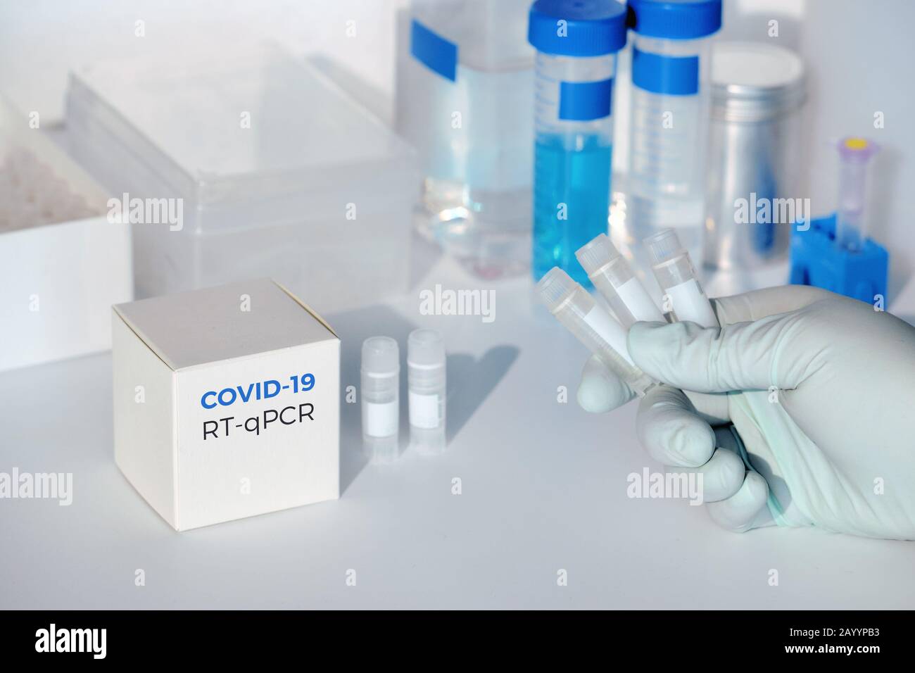 Quick novel COVID-19 coronavirus test kit. 2019 nCoV pcr diagnostics kit. Hand in glove with the box. RT-PCR kit detects covid19 virus in patients sam Stock Photo
