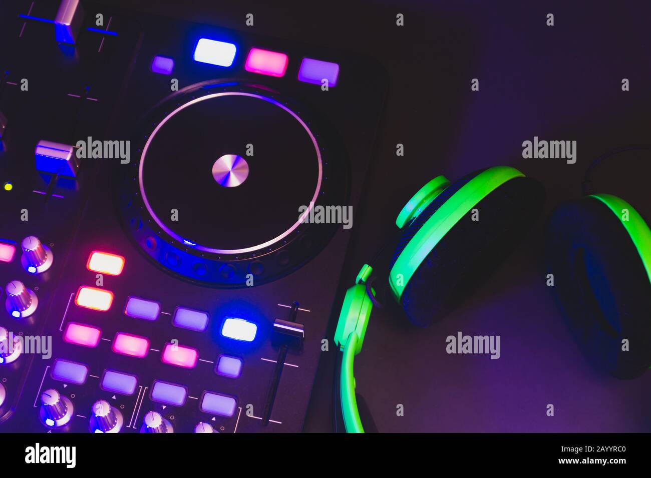 Dj sound mixer controller with knobs and sliders close up. audio mixing