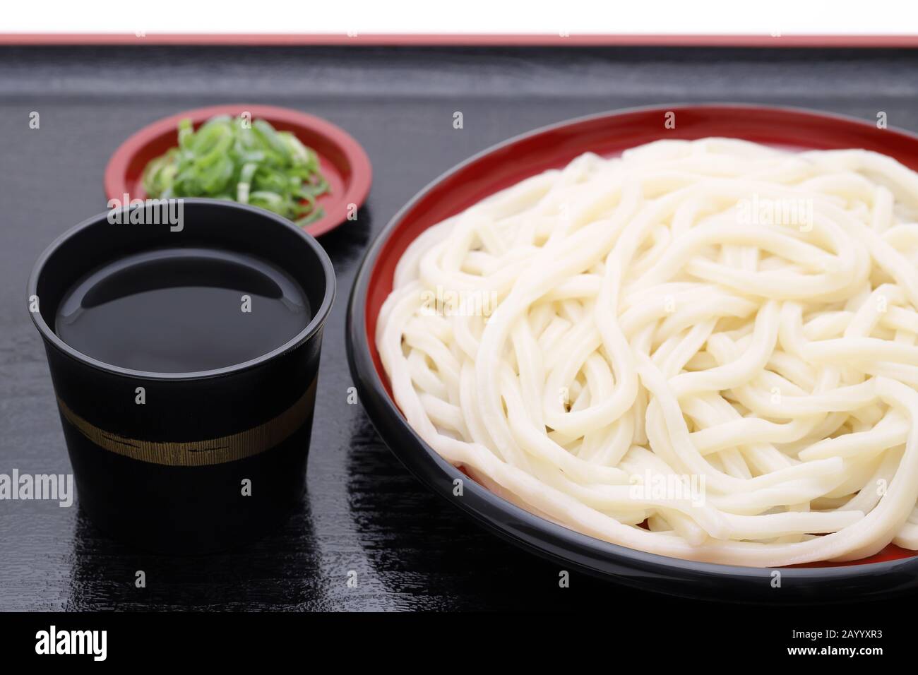 Japanese Zaru udon noodles in a dish with soy sauce on wooden tray