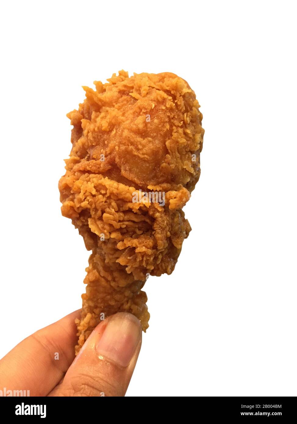 Golden fried chicken in hand on white background Stock Photo - Alamy