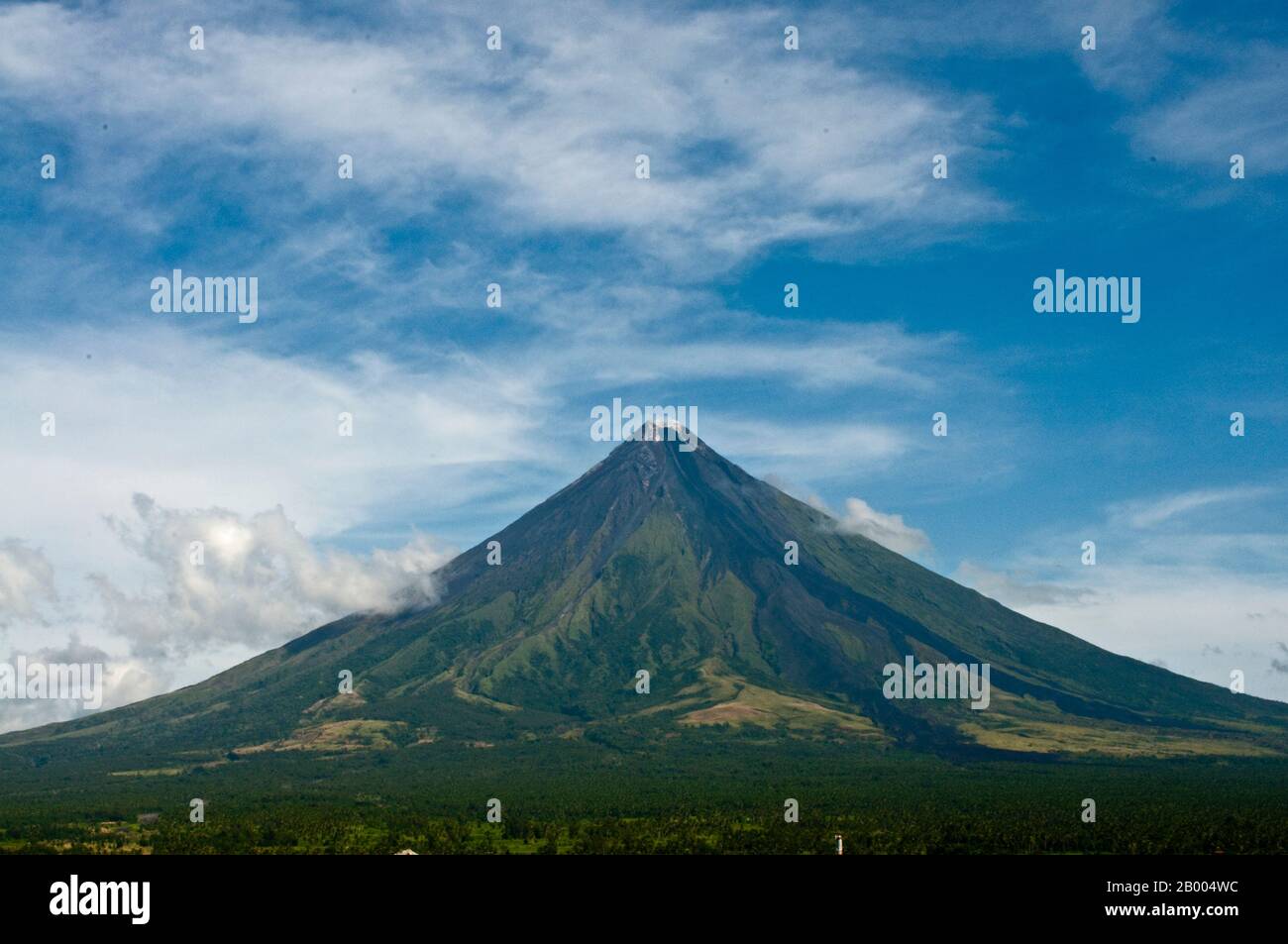 Mayon Volcano or Mt. Mayon is a sacred and active stratovolcano. Renowned  for its perfect cone, it is a popular tourist destination. Stock Photo