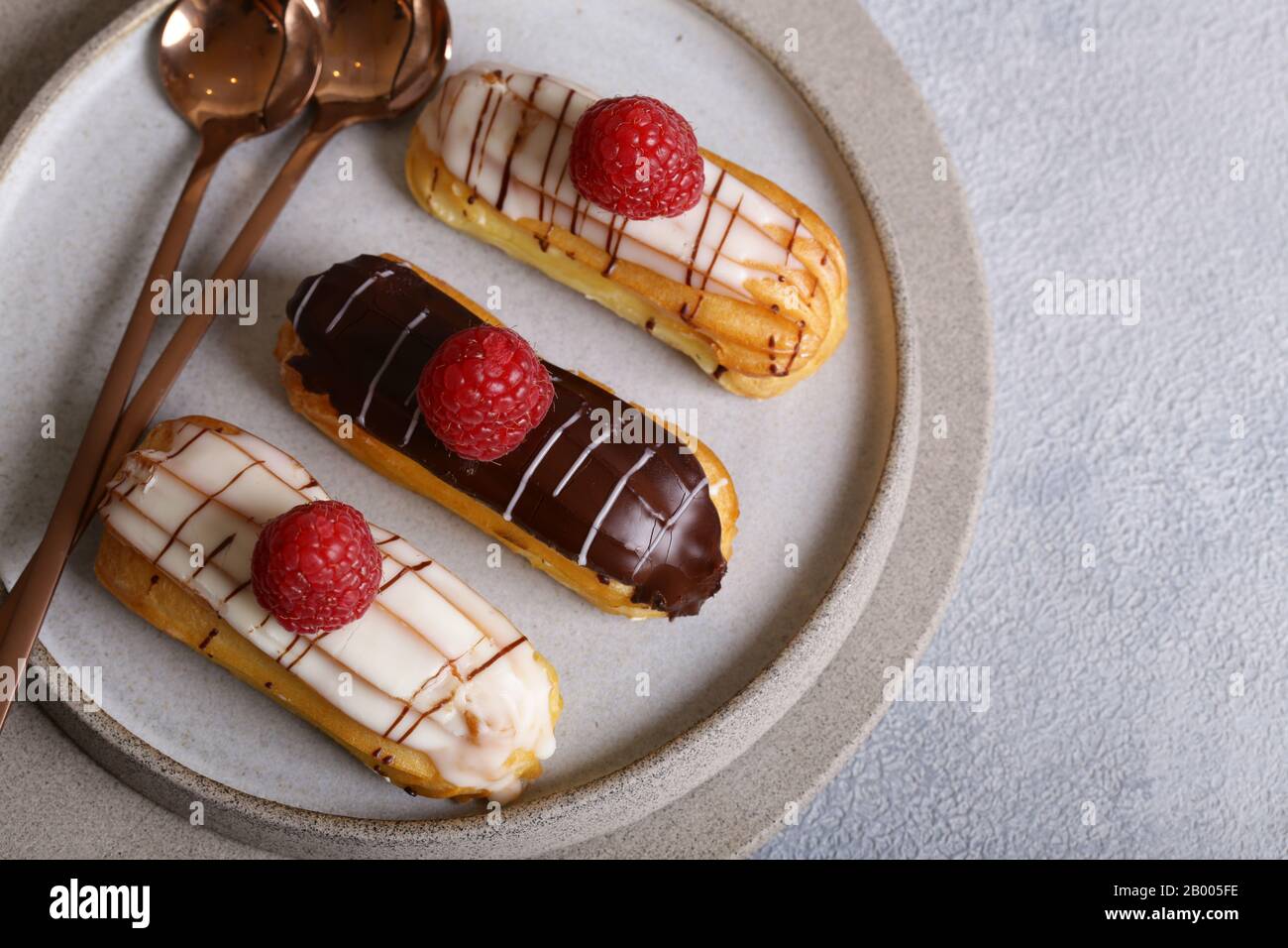 French pastries of choux pastry eclairs Stock Photo Alamy