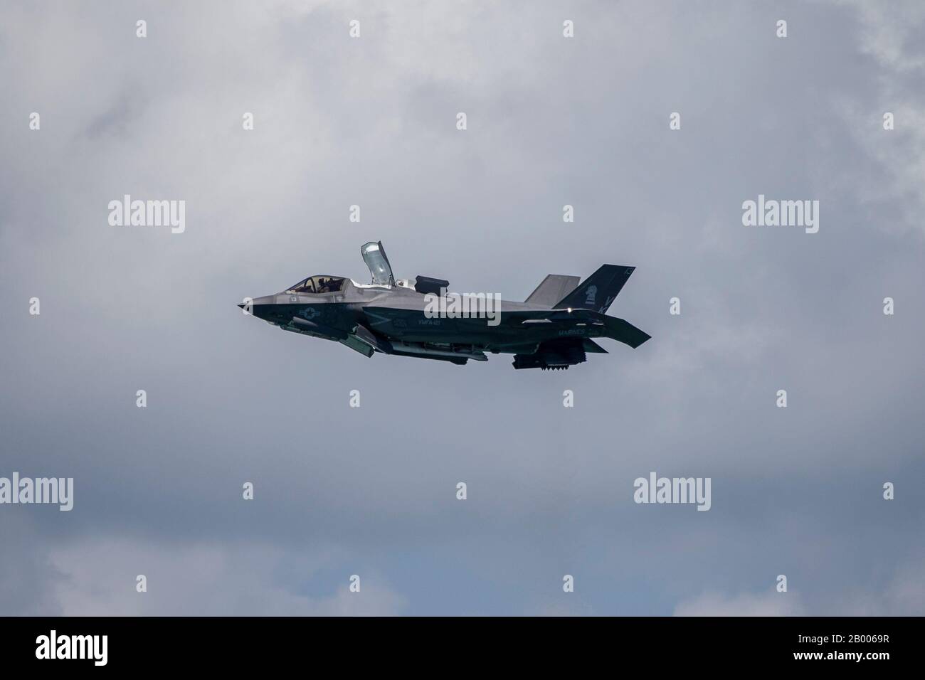 A U.S. Marine Corps F-35B Lightning II with Marine Fighter Attack Squadron (VMFA) 121 hovers in the air during an aerial demonstration at the Singapore Airshow 2020 near Changi Exhibition Center, Republic of Singapore, 2020 Feb. 15, 2020. Singapore Airshow 2020 showcased various U.S. military aircraft and featured the F-22 Raptor and the F-35B Lightning II aerial demo teams. This was the first time both stealth fighter attack jets participated in the aerial demonstration, giving spectators an unprecedented look at the advanced fifth generation fighters. (U.S. Marine Corps photo by Staff Sgt. V Stock Photo
