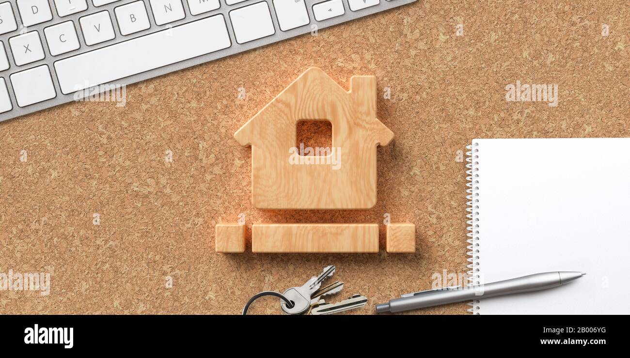 house symbol on cork background with office items Stock Photo