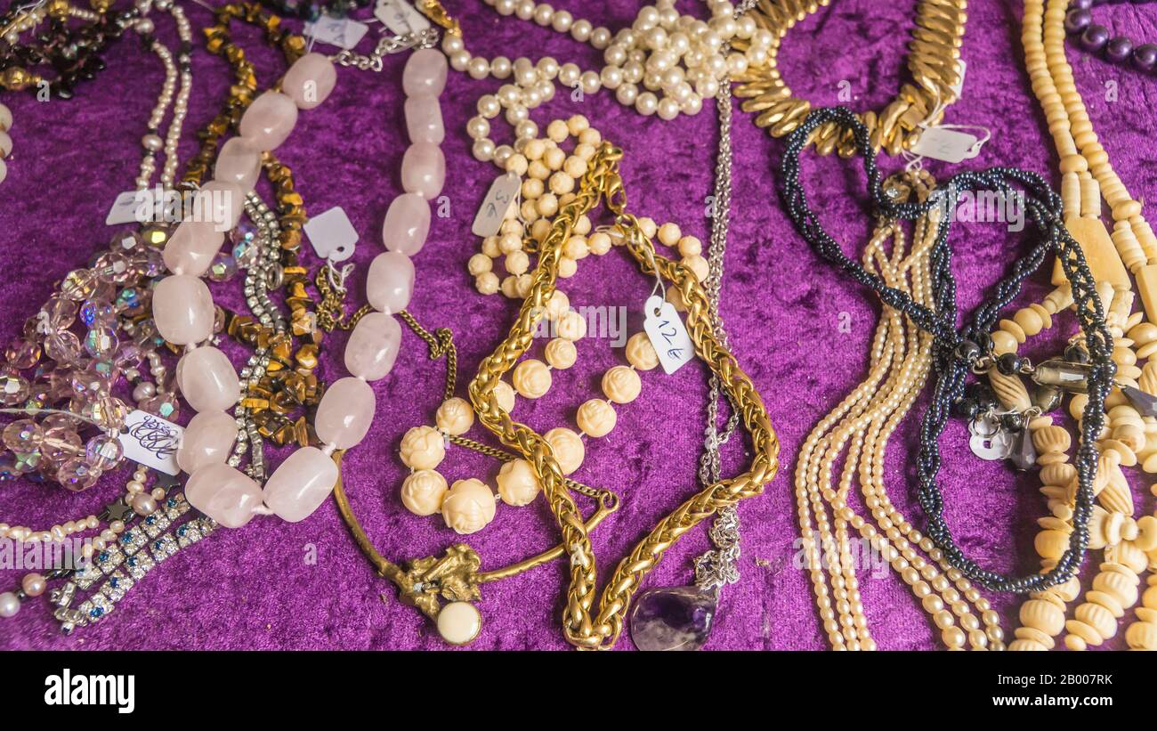 Antique costume jewelry in a display Stock Photo Alamy