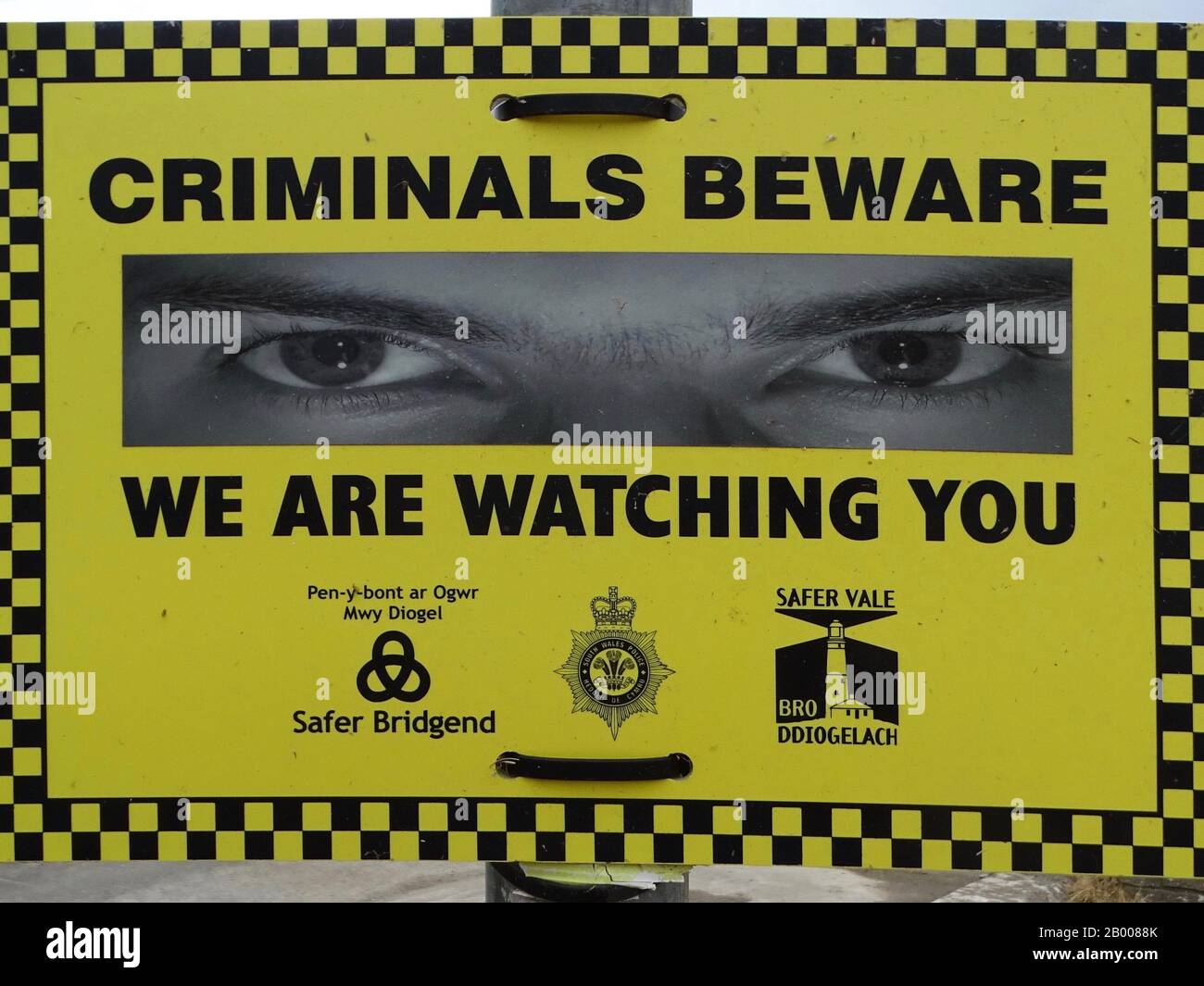 A sign advising criminals that they are being watched. Stock Photo