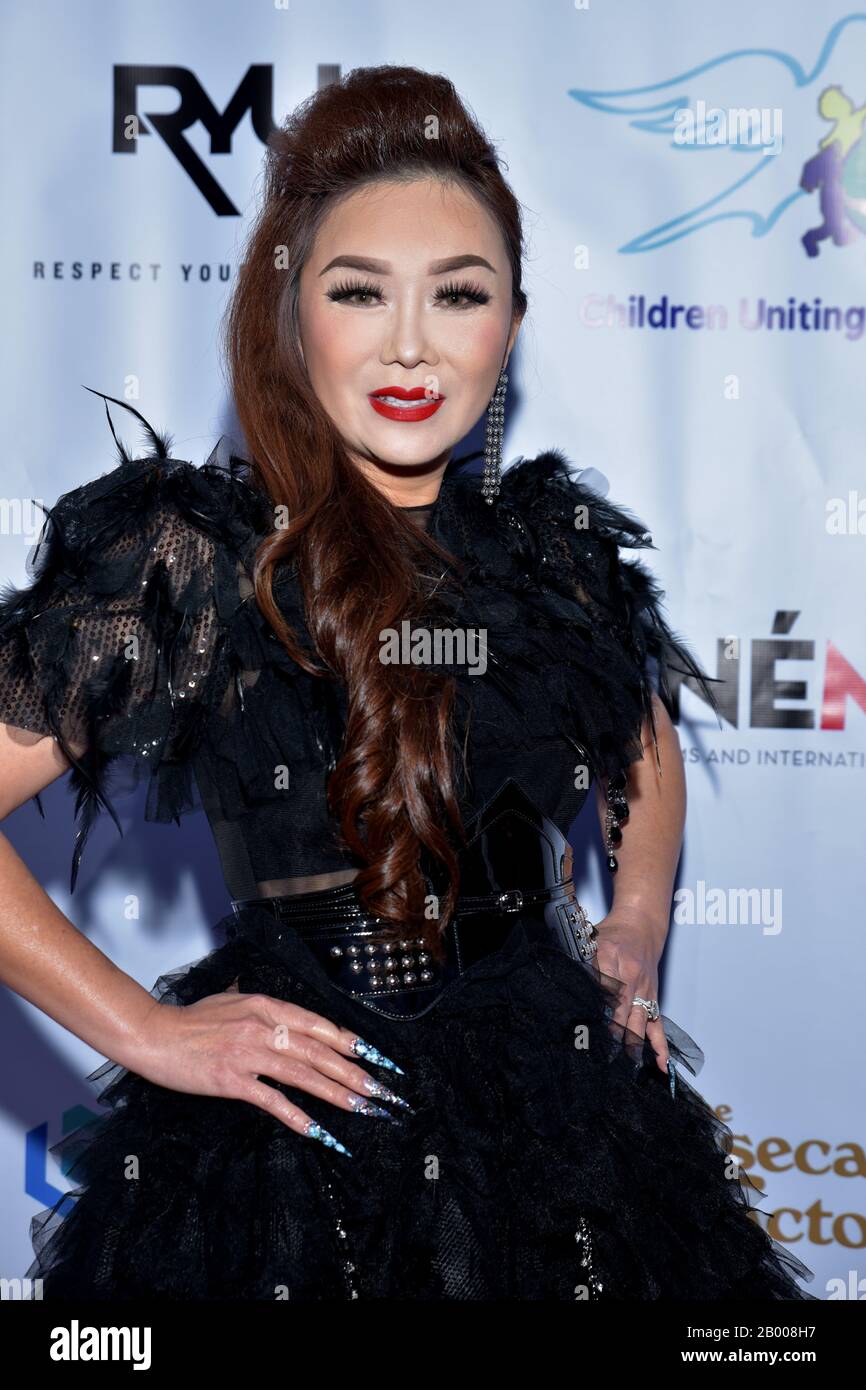 mMODEL WEARING SOLID PURPLE DRESS Stock Photo