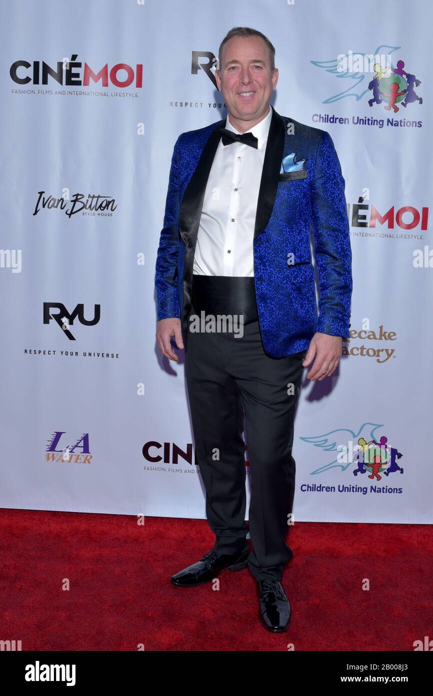 mMODEL WEARING SOLID PURPLE DRESS Stock Photo