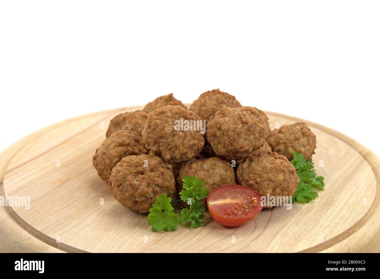 Fried meatballs on a wooden plate Stock Photo