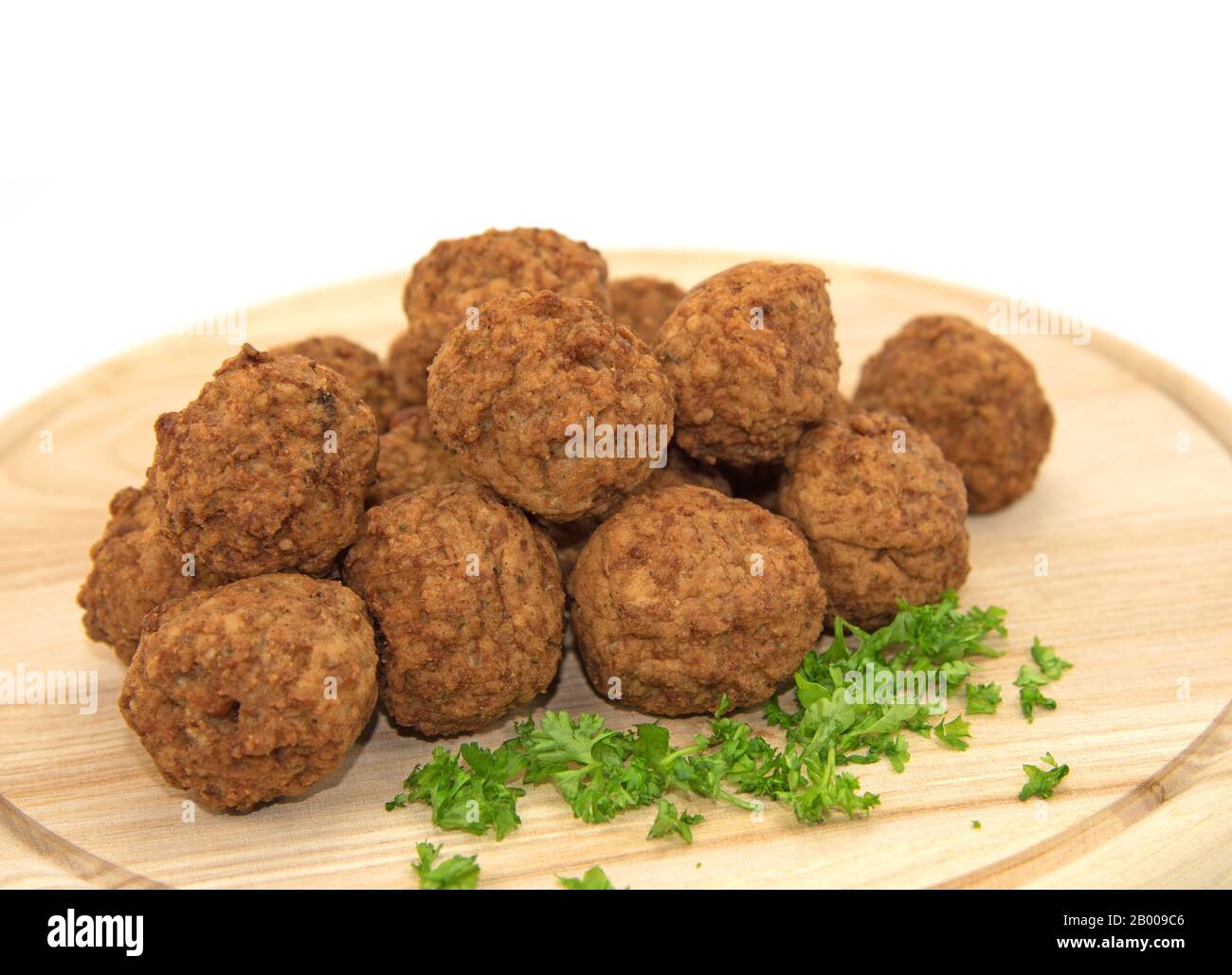 Fried meatballs on a wooden plate Stock Photo