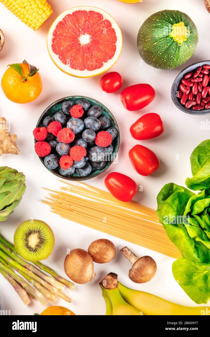 Vegan food, healthy diet flat lay. Fruits, vegetables, legumes ...