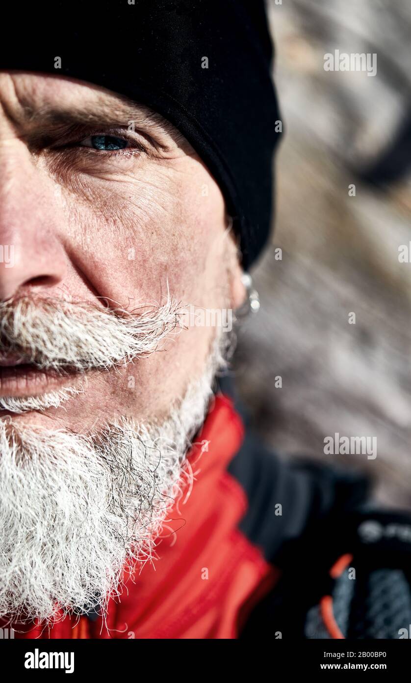 Emotional Portrait of serious elderly runner man with grey. Concept of power and c masculinity. Stock Photo