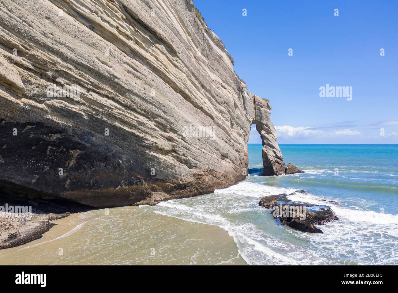 Cliff with rock arch, Cape Farewell, Tasman Sea, Golden Bay, South Island, New Zealand Stock Photo