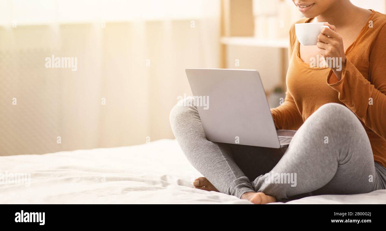 Unrecognizable Black Woman Using Laptop Having Morning Coffee In Bed ...