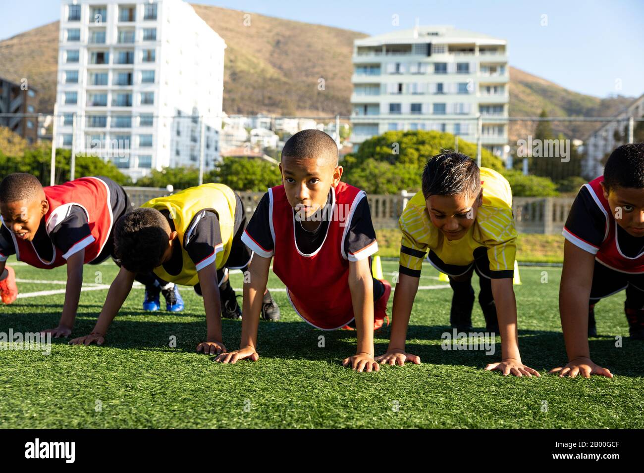 Front view soccer players doing push ups Stock Photo Alamy