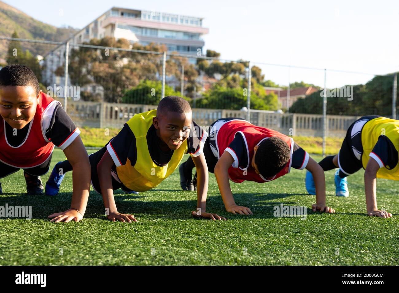Front view soccer players doing push ups Stock Photo Alamy