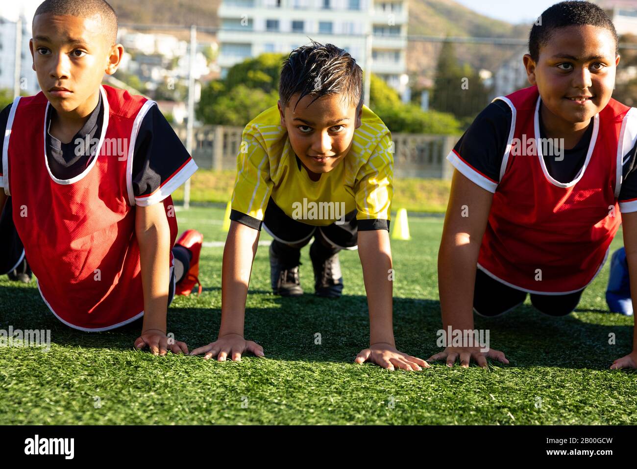 Front view soccer players doing push ups Stock Photo Alamy