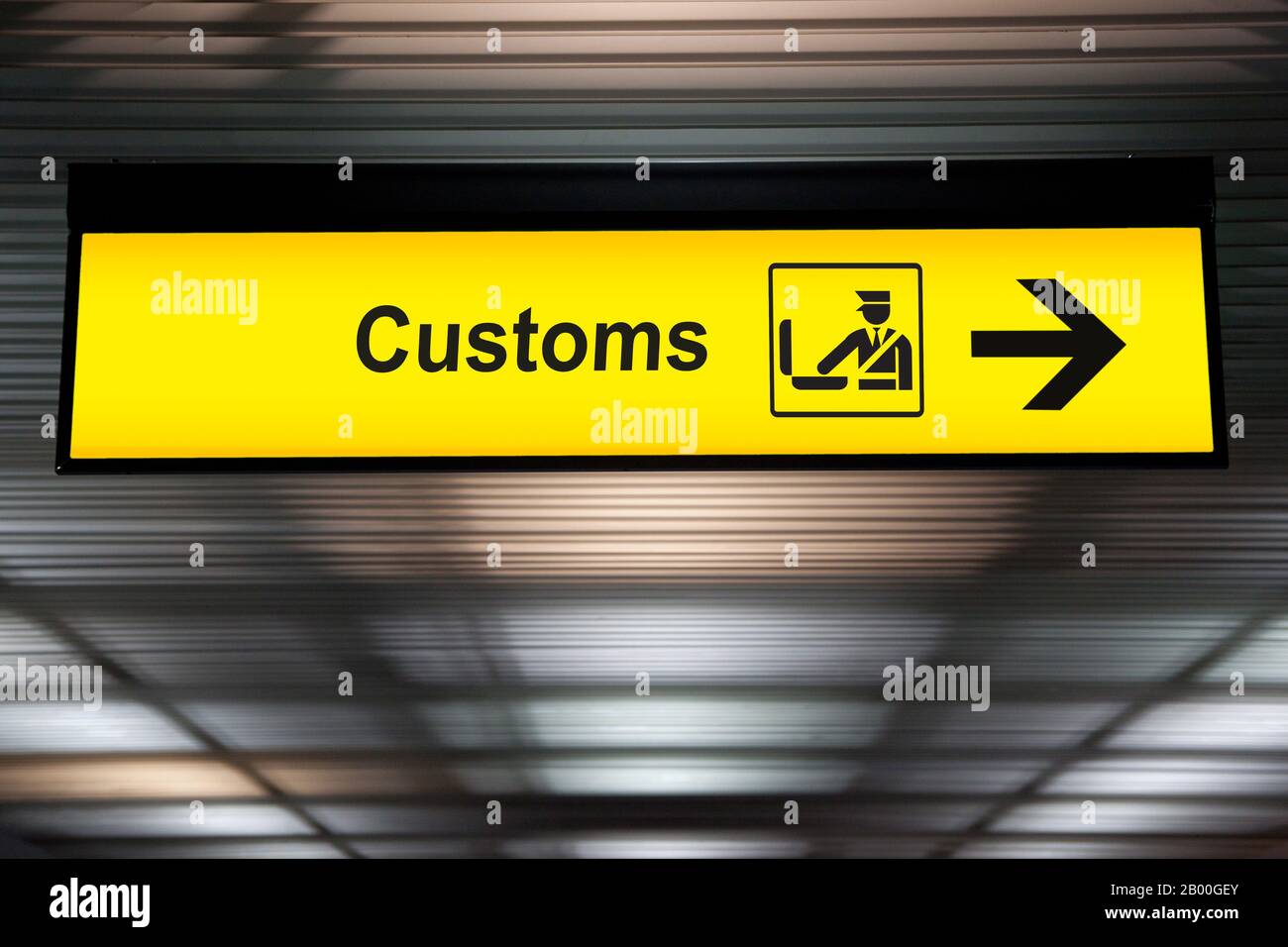 airport customs declare sign with icon and arrow hanging from airport ceiling at international terminal. customs declare for import and export concept Stock Photo