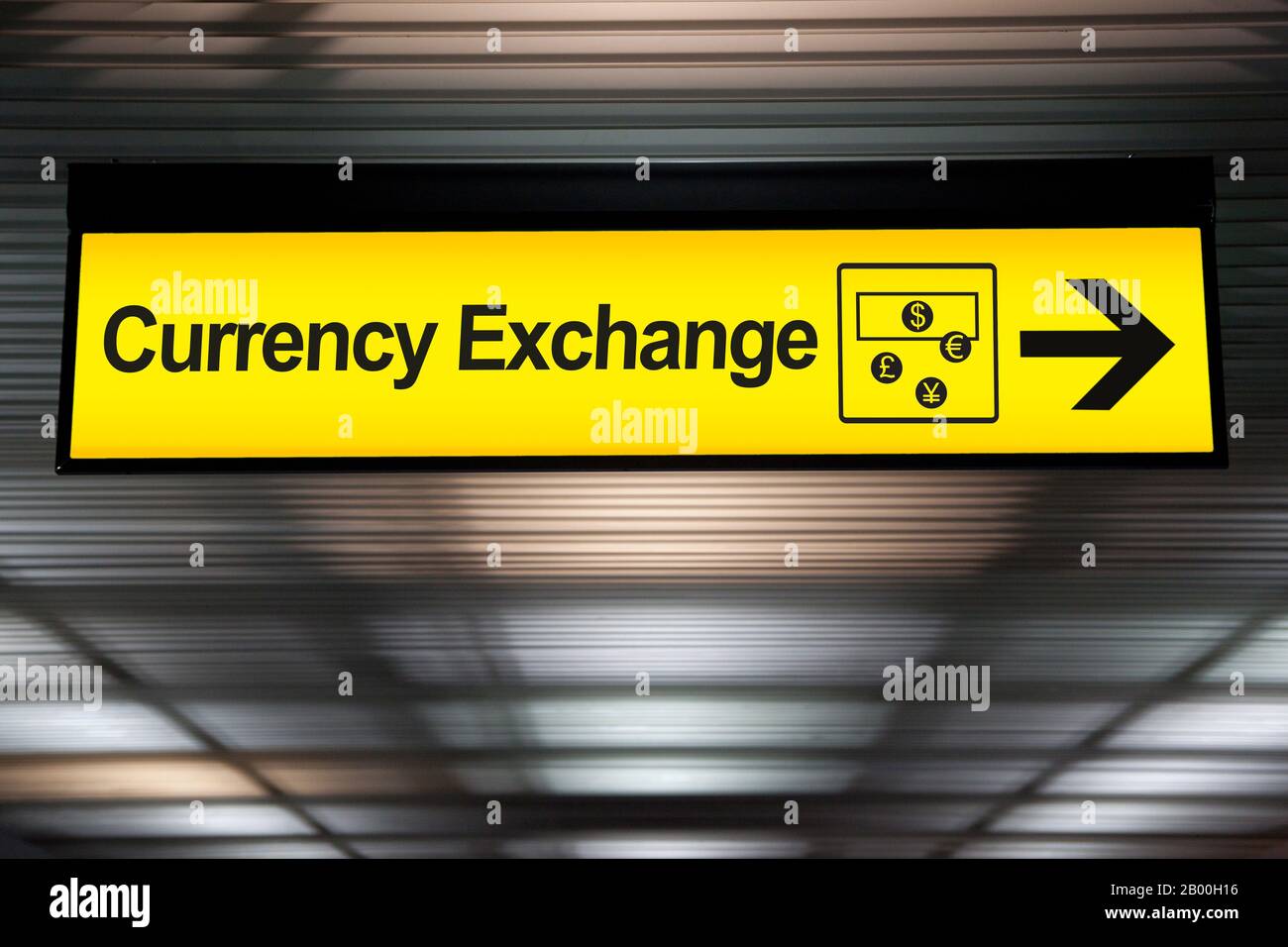 sign currency exchange at the airport with money currency icon and arrow for direction to currency exchange booth counter service for tourist Stock Photo