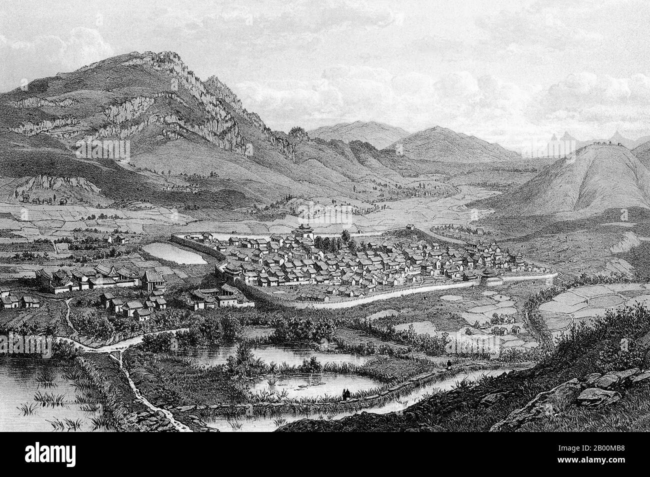China: The walled city of Pu'er (now Simao) in southern Yunnan c. 1868.  The Tea Horse Road (Cha Ma Dao) was a network of mule caravan paths winding through the mountains of Yunnan, Sichuan and Tibet in Southwest China.  It is also sometimes referred to as the Southern Silk Road and Ancient Tea and Horse Road. From around a thousand years ago, the Ancient Tea Route was a trade link from Yunnan, one of the first tea-producing regions, to India via Burma, to Tibet, and to central China via Sichuan Province. In addition to tea, the mule caravans carried salt. Stock Photo