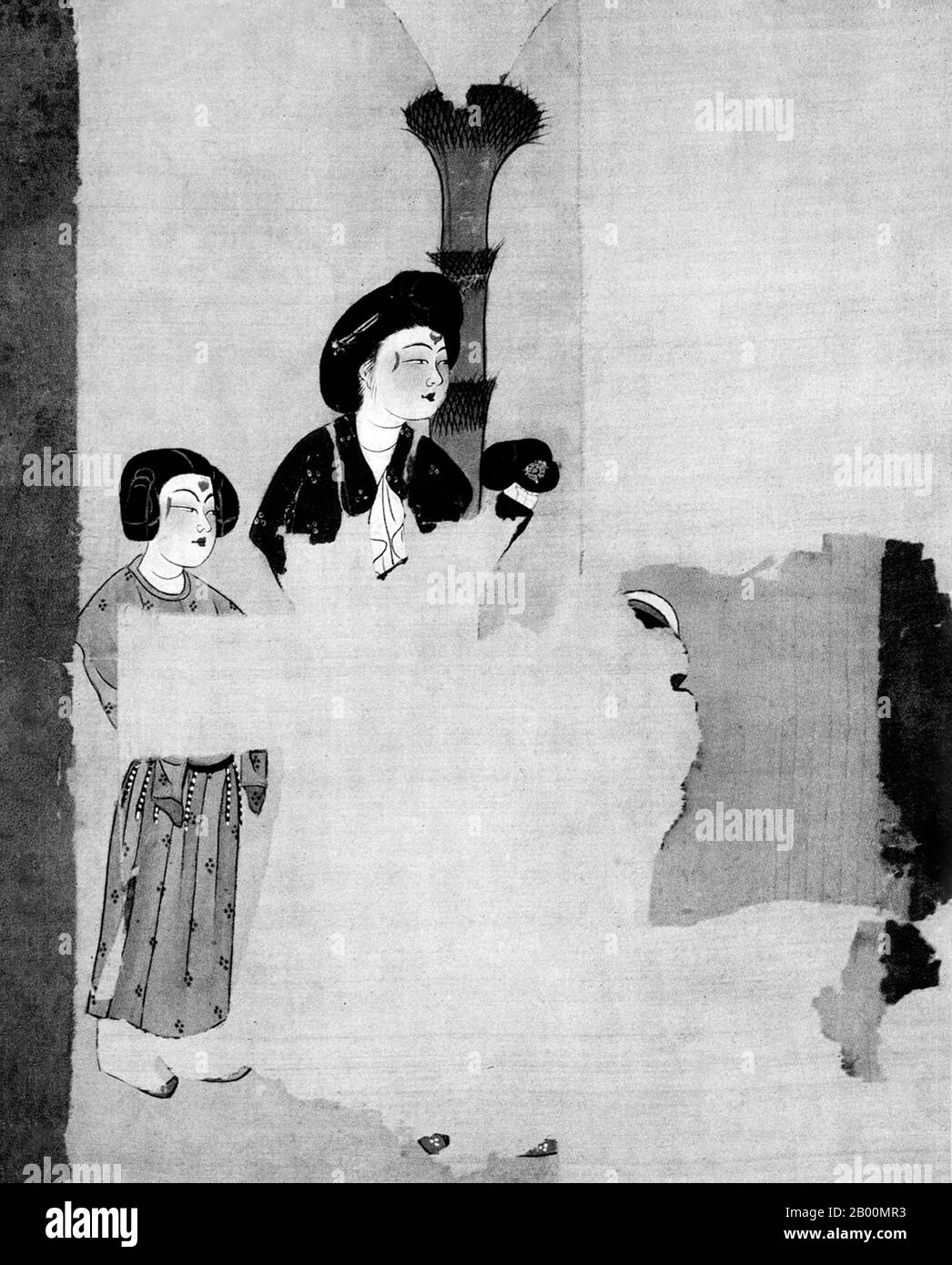 China: Part of a silk painting showing a lady and her page, from Astana Cemetery, Turfan, Xinjiang.  The Astana Graves are a series of underground tombs located 6km from the ancient city of Gaochang, and 42km from Turpan, in Xinjiang, China. The tombs were used by the inhabitants of Gaochang, both commoners and locals, for about 600 years from 200 CE – 800 CE.  The complex covers 10 square kilometers and contains over 1,000 tombs. Different plots for separate castes and families are marked by gravel dividers. Due to the arid environment many important artifacts have been well preserved. Stock Photo