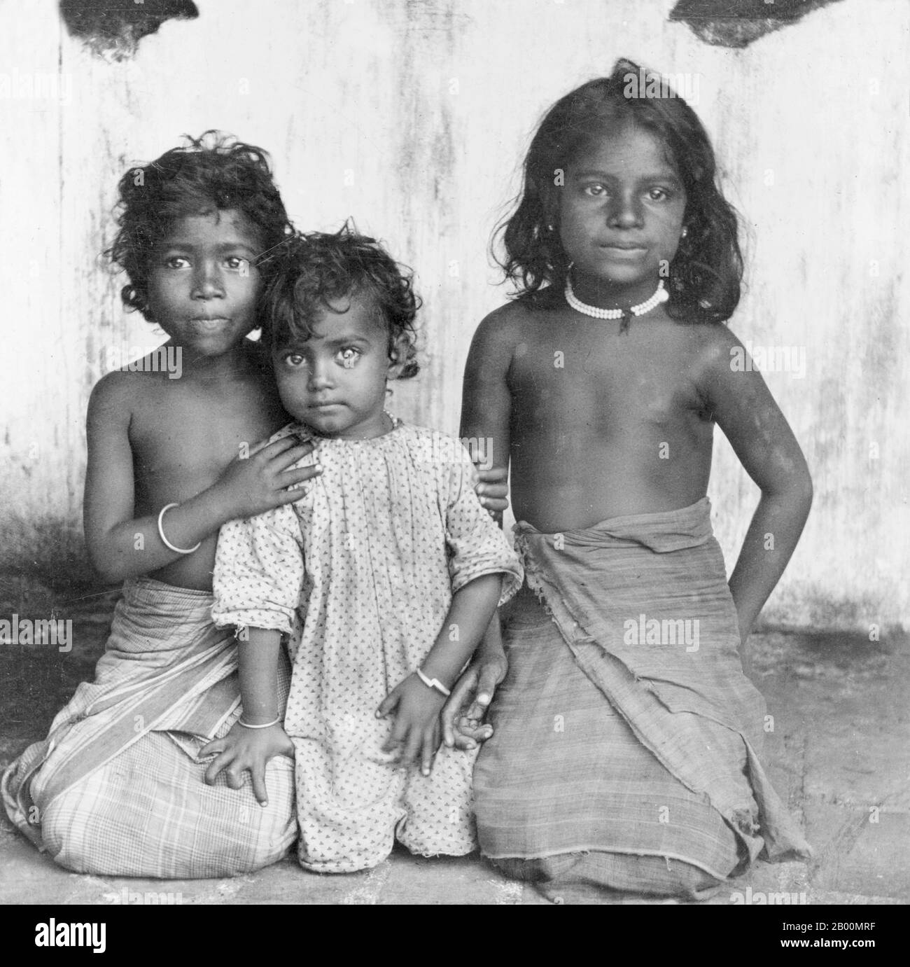 Sri Lanka: Portrait of three young Sinhalese girls, late 19th century.  The Sinhalese are an ethnic group forming the majority in Sri Lanka, constituting 74% of the Sri Lankan population. They number approximately 15 million in the world. They live mainly in central, south and west Sri Lanka. According to legend they are the descendants of the exiled Prince Vijaya who arrived from North-East India to Sri Lanka in 543 BCE. The Sinhalese identity is based on language, heritage and religion. The vast majority of Sinhalese are Theravada Buddhists and speak Sinhala, an Indo-European language. Stock Photo