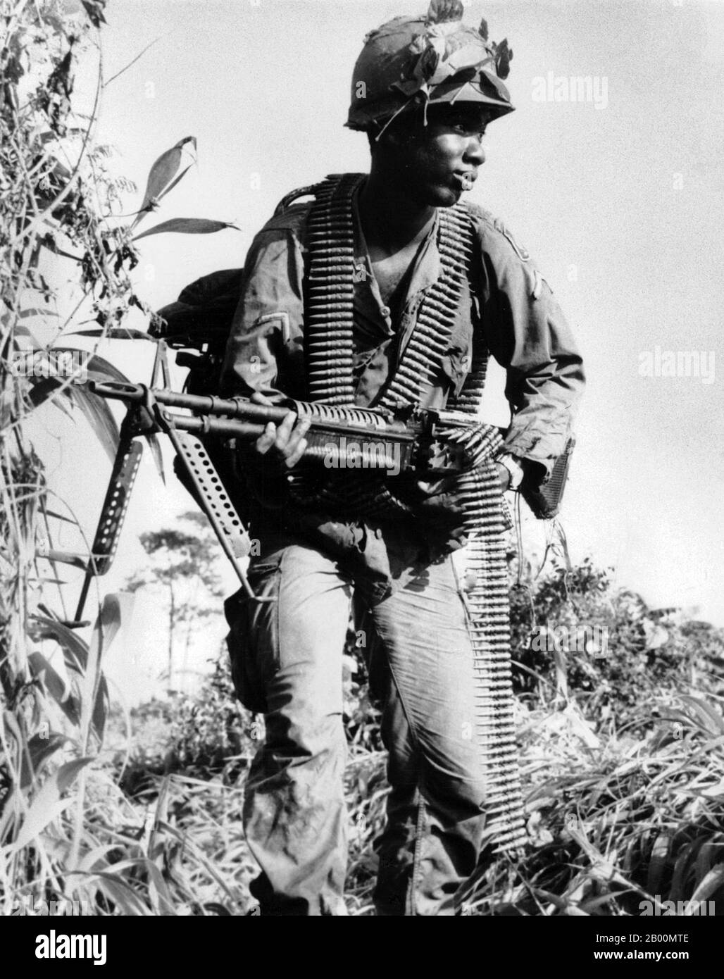 Vietnam: African-American soldier on patrol, c. 1966.  The Second Indochina War, known in America as the Vietnam War, was a Cold War era military conflict that occurred in Vietnam, Laos, and Cambodia from 1 November 1955 to the fall of Saigon on 30 April 1975. This war followed the First Indochina War and was fought between North Vietnam, supported by its communist allies, and the government of South Vietnam, supported by the U.S. and other anti-communist nations. The U.S. government viewed involvement in the war as a way to prevent a communist takeover of South Vietnam. Stock Photo