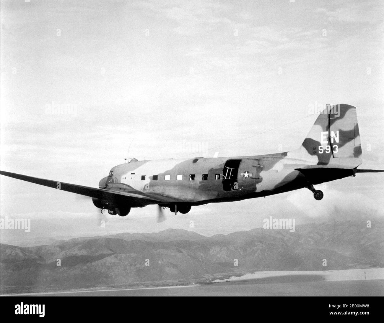 Vietnam: A U.S. Air Force Douglas AC-47D Spooky gunship flying out of Nha Trang Air Base, South Vietnam, in 1968-69.  The Second Indochina War, known in America as the Vietnam War, was a Cold War era military conflict that occurred in Vietnam, Laos, and Cambodia from 1 November 1955 to the fall of Saigon on 30 April 1975. This war followed the First Indochina War and was fought between North Vietnam, supported by its communist allies, and the government of South Vietnam, supported by the U.S. and other anti-communist nations. Stock Photo