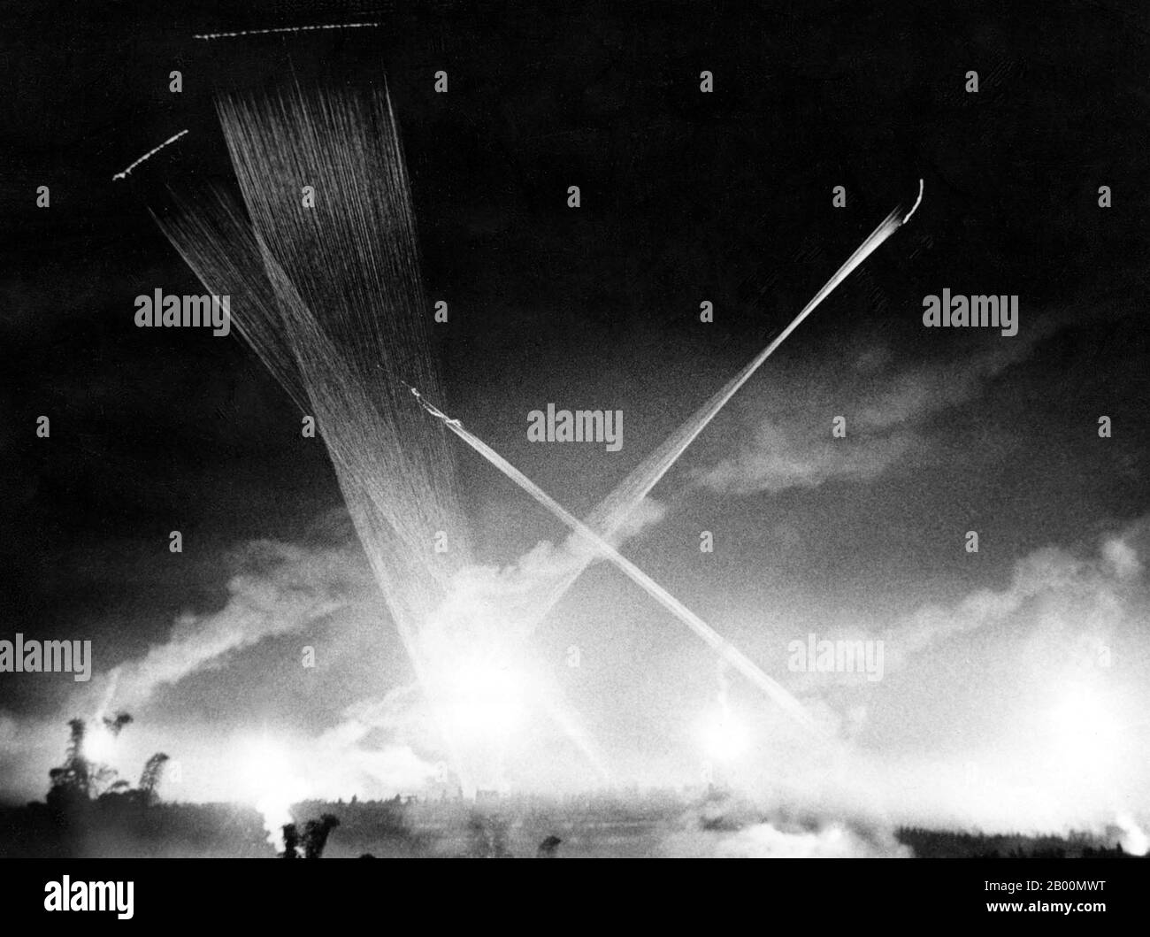 Vietnam: Night attack near Saigon.  This time lapse photo shows tracer round trajectories, probably from a A U.S. Air Force Douglas AC-47D 'Spooky' gunship. The Douglas AC-47 Spooky (also nicknamed 'Puff, the Magic Dragon') was the first in a series of gunships developed by the United States Air Force during the Vietnam War. It was felt that more firepower than could be provided by light and medium ground-attack aircraft was needed in some situations when ground forces called for close air support. Stock Photo