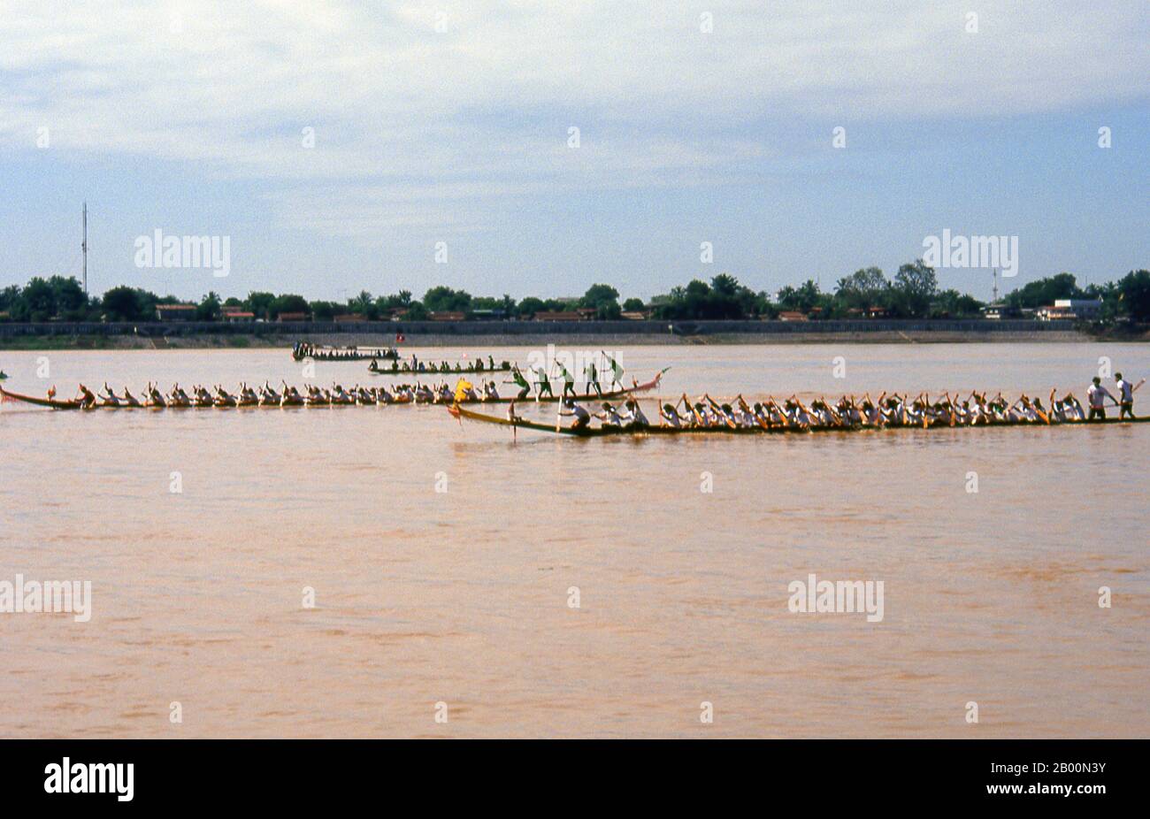 Laos: Boat races on the Mekong River at Vientiane, Bun Nam Festival. Photo by David Henley.  In Laos, the Awk Phansaa (Awk Watsa, full moon) Festival celebrates the end of the three-month rains retreat. Monks are allowed to leave the monasteries to travel and are presented with robes, alms bowls and other requisites of the renunciative life.  On the eve of Awk Phansaa many people fashion small banana-leaf boats carrying candles, incense and other offerings, and float them in rivers, a custom known as Lai Hua Fai, similar to Loy Krathong in Thailand. Stock Photo