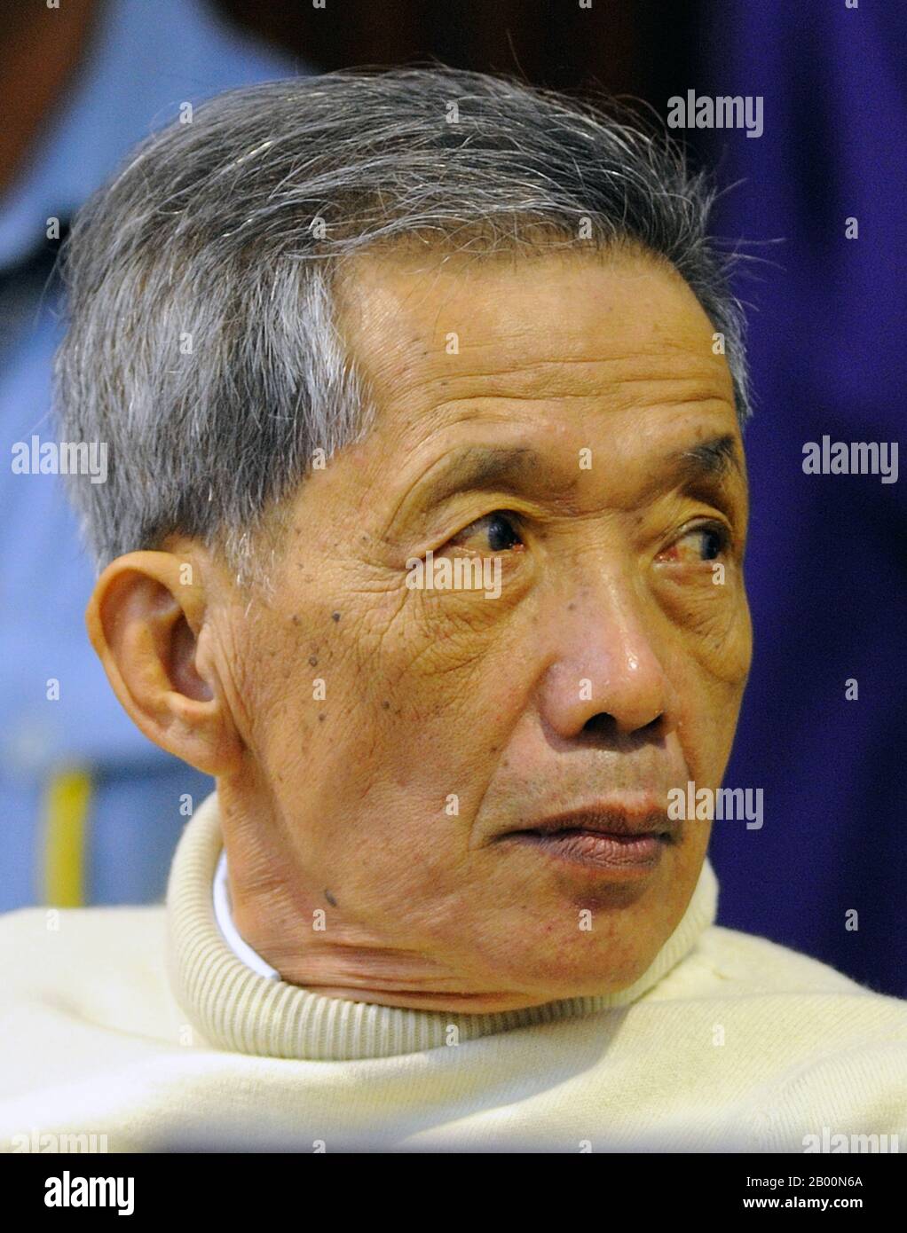 Cambodia: Kang Kek Iew, aka Comrade Duch, former Khmer Rouge Commandant at Tuol Sleng S21 Prison and Santebal chief, 26 November 2009. Photo by ECCC Pool/Mark Peters (CC BY 2.0 License).  Photo taken by Mark Peters during trial of suspect at The Extraordinary Chambers in the Courts of Cambodia for the Prosecution of Crimes Committed During the Period of Democratic Kampuchea, commonly known as Cambodia Tribunal. Stock Photo