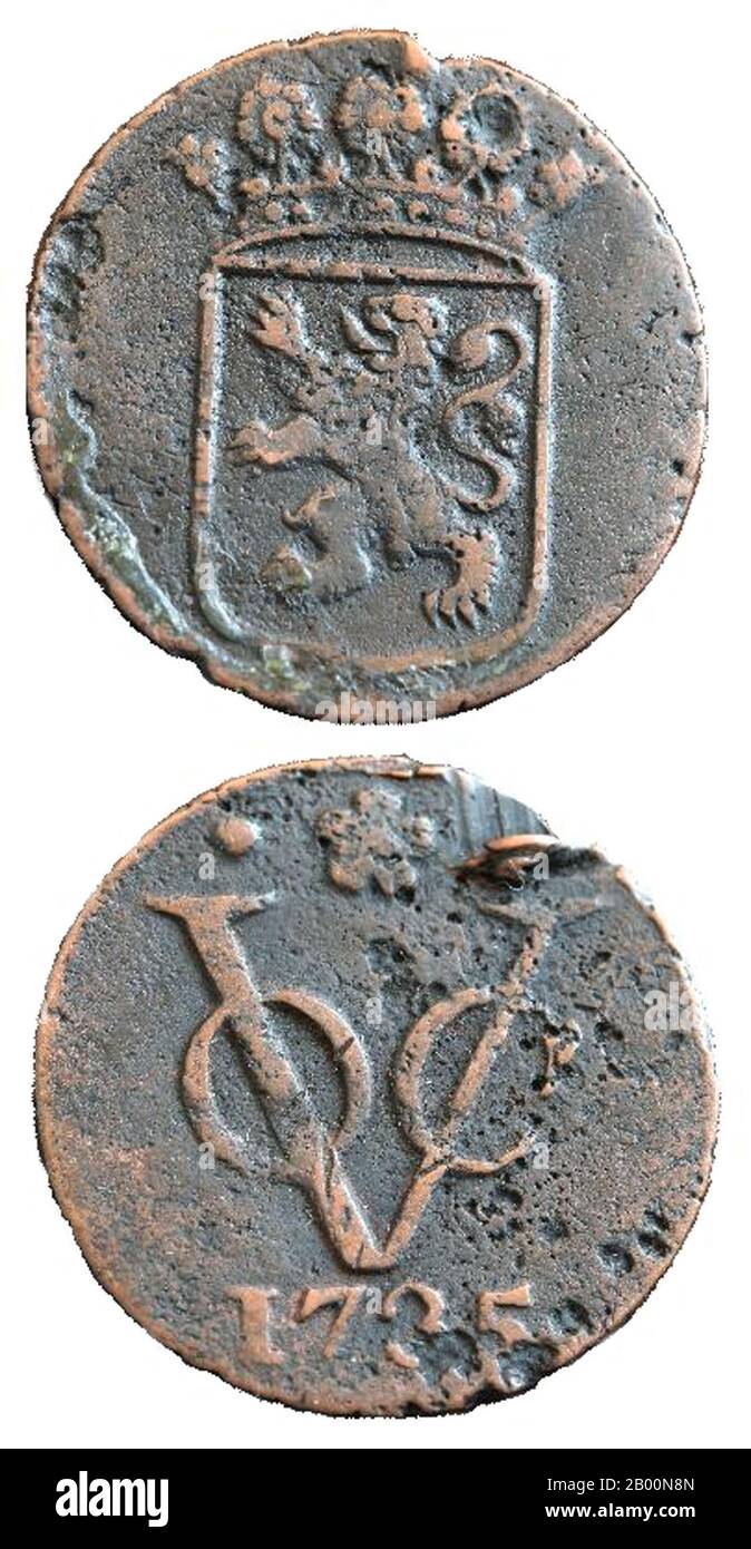 Netherlands: Two sides of a duit, a coin minted in 1735 by the VOC or Dutch East India Company. Svdmolen (CC BY 2.5 License).  The Dutch East India Company (Dutch: Vereenigde Oost-Indische Compagnie, VOC) was a chartered company established in 1602, when the States-General of the Netherlands granted it a 21-year monopoly to carry out colonial activities in Asia. It was the first multinational corporation in the world and the first company to issue stock. It was also arguably the world's first megacorporation, possessing quasi-governmental powers, including the ability to wage war. Stock Photo