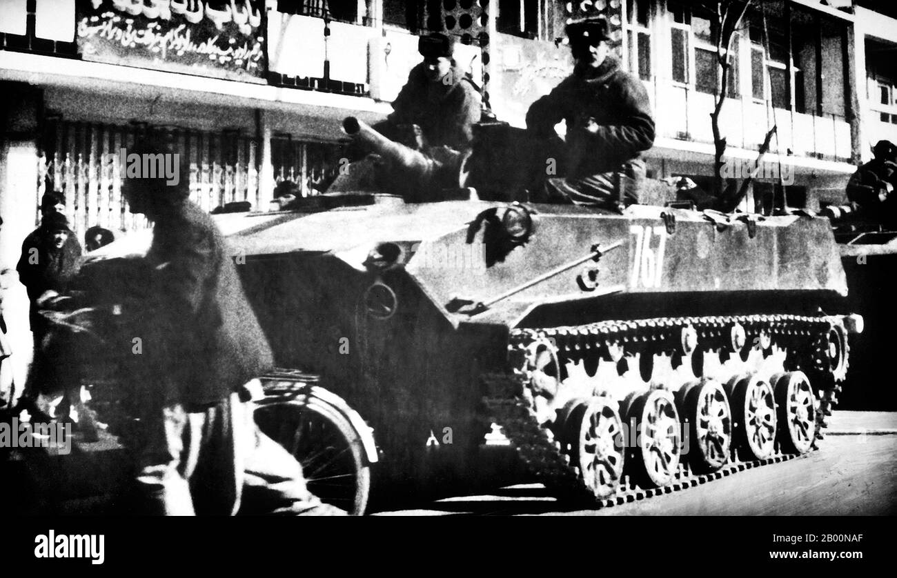 Afghanistan: Soldiers ride aboard a Soviet BMD airborne combat vehicle in the streets of Kabul, 25 March 1986.  The Soviet War in Afghanistan was a nine-year conflict involving the Soviet Union, supporting the Marxist government of the Democratic Republic of Afghanistan against the indigenous Afghan Mujahideen and foreign ‘Arab–Afghan’ volunteers. The mujahideen found other support from a variety of sources including the United States, Saudi Arabia, the United Kingdom, Pakistan, Egypt, China and other nations. The Afghan war became a proxy war in the broader context of the late Cold War. Stock Photo