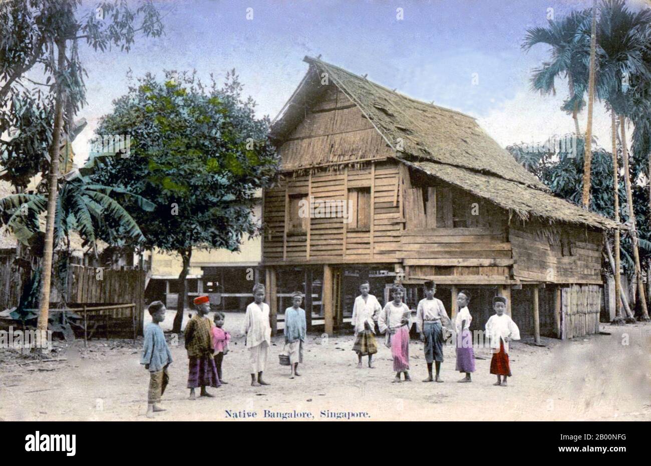 Singapore: Malay children and stilt house at 'Bangalore Village', postcard from Singapore, 1919.  Singapore hosted a trading post of the East India Company in 1819 with permission from the Sultanate of Johor. The British obtained sovereignty over the island in 1824 and Singapore became one of the British Straits Settlements in 1826. Occupied by the Japanese in World War II, Singapore declared independence, uniting with other former British territories to form Malaysia in 1963, although it was separated from Malaysia two years later and became one of the successful Four Asian Tigers. Stock Photo