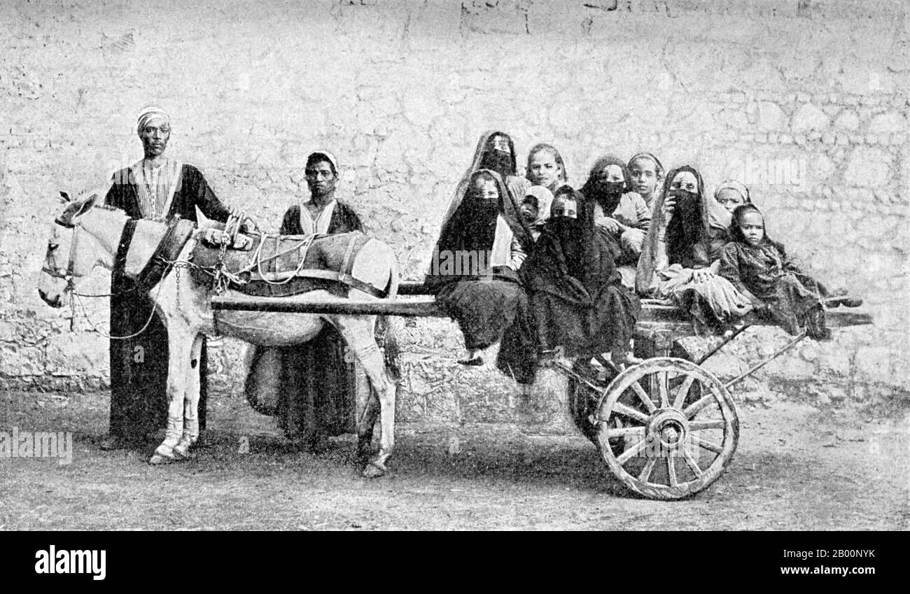 Turkey: Transporting veiled women and children by horse cart, Vlas Mikhailovich Doroshevich, c. 1900.  The Ottoman Empire's power and prestige peaked in the 16th and 17th centuries, particularly during the reign of Suleiman the Magnificent. The empire was often at odds with the Holy Roman Empire in its steady advance towards Central Europe through the Balkans and the southern part of the Polish-Lithuanian Commonwealth.  At sea, the empire contended with the Holy Leagues, composed of Habsburg Spain, the Republic of Venice and the Knights of St. John, for control of the Mediterranean. Stock Photo