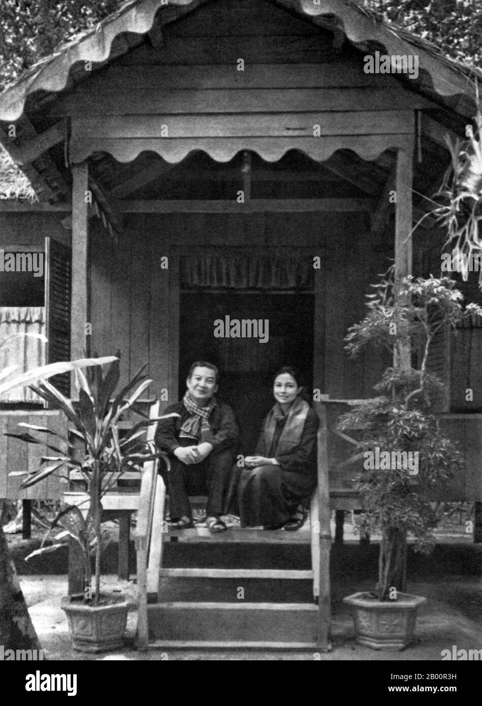 Cambodia: Prince Norodom Sihanouk and Princess Monique pose in Khmer Rouge  clothing on the steps of their wooden house in the Khmer Rouge 'liberated  zone', 1973. Between 1970 and 1975 Norodom Sihanouk