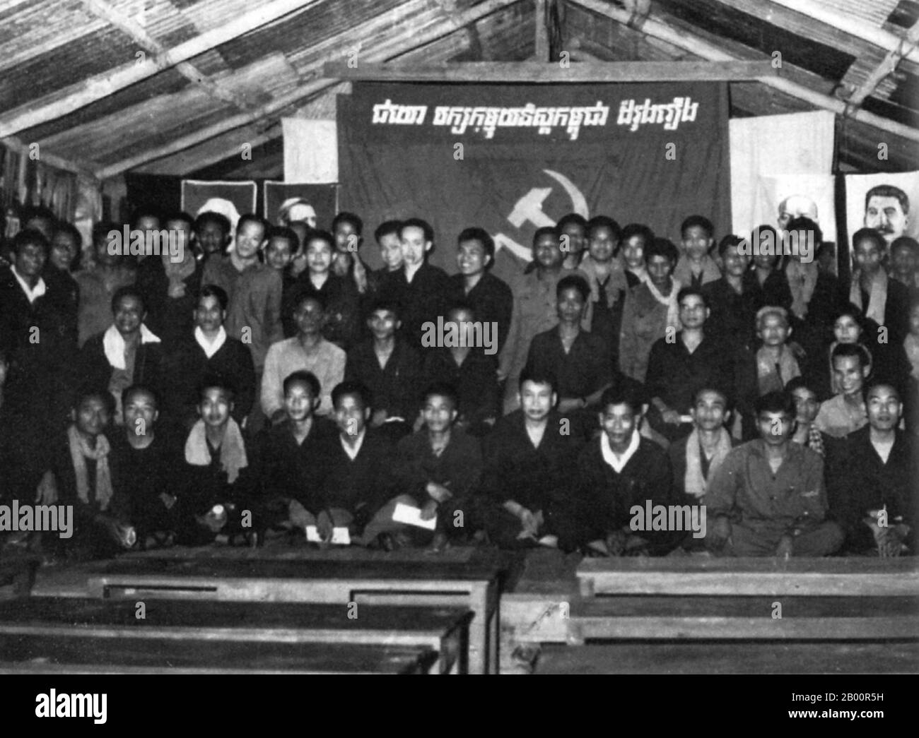 Cambodia: The Communist Party of Kampuchea's Third Congress, Kompong Thom Province, 1971. Pol Pot sits cross-legged in the centre of the front row, while portraits of Marx, Engels, Lenin and Stalin hang on the walls.  The Khmer Rouge, or Communist Party of Kampuchea, ruled Cambodia from 1975 to 1979, led by Pol Pot, Nuon Chea, Ieng Sary, Son Sen and Khieu Samphan. It is remembered primarily for its brutality and policy of social engineering which resulted in millions of deaths. Its attempts at agricultural reform led to widespread famine. Stock Photo