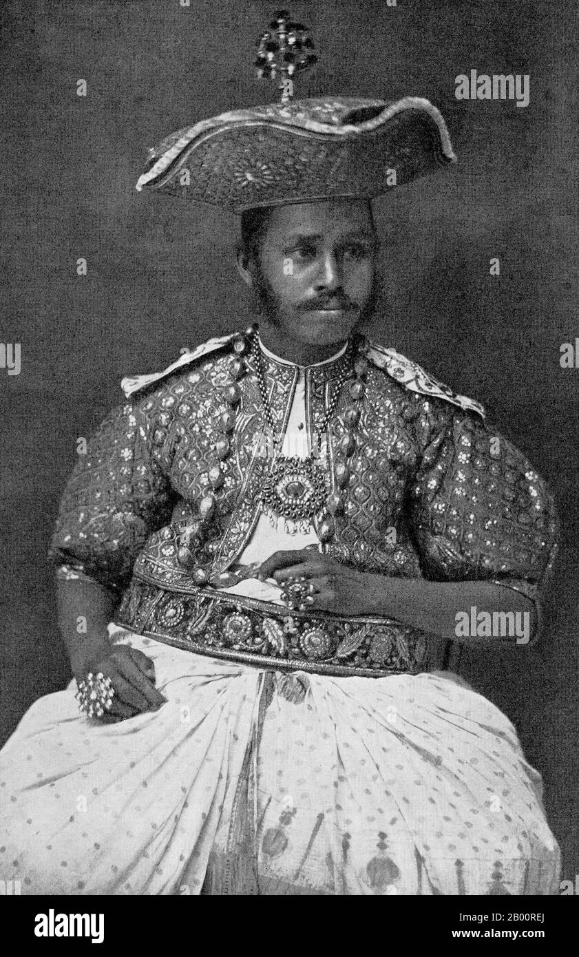 Sri Lanka: A Kandyan chief in full ceremonial attire. Photograph by Charles T. Scowen (1852-1948), 1870s.  Charles Thomas Scowen (11 March 1852 - 24 November 1948) was a British photographer active during the late nineteenth century, primarily from 1871-1890. He worked out of Sri Lanka and British India with his own established studio, Scowen & Co. His first studio was in Kandy, but he had opened a second in Colombo by the 1890s. His photos were famed for their lighting, strong compositional qualities and technically superior printing. Stock Photo