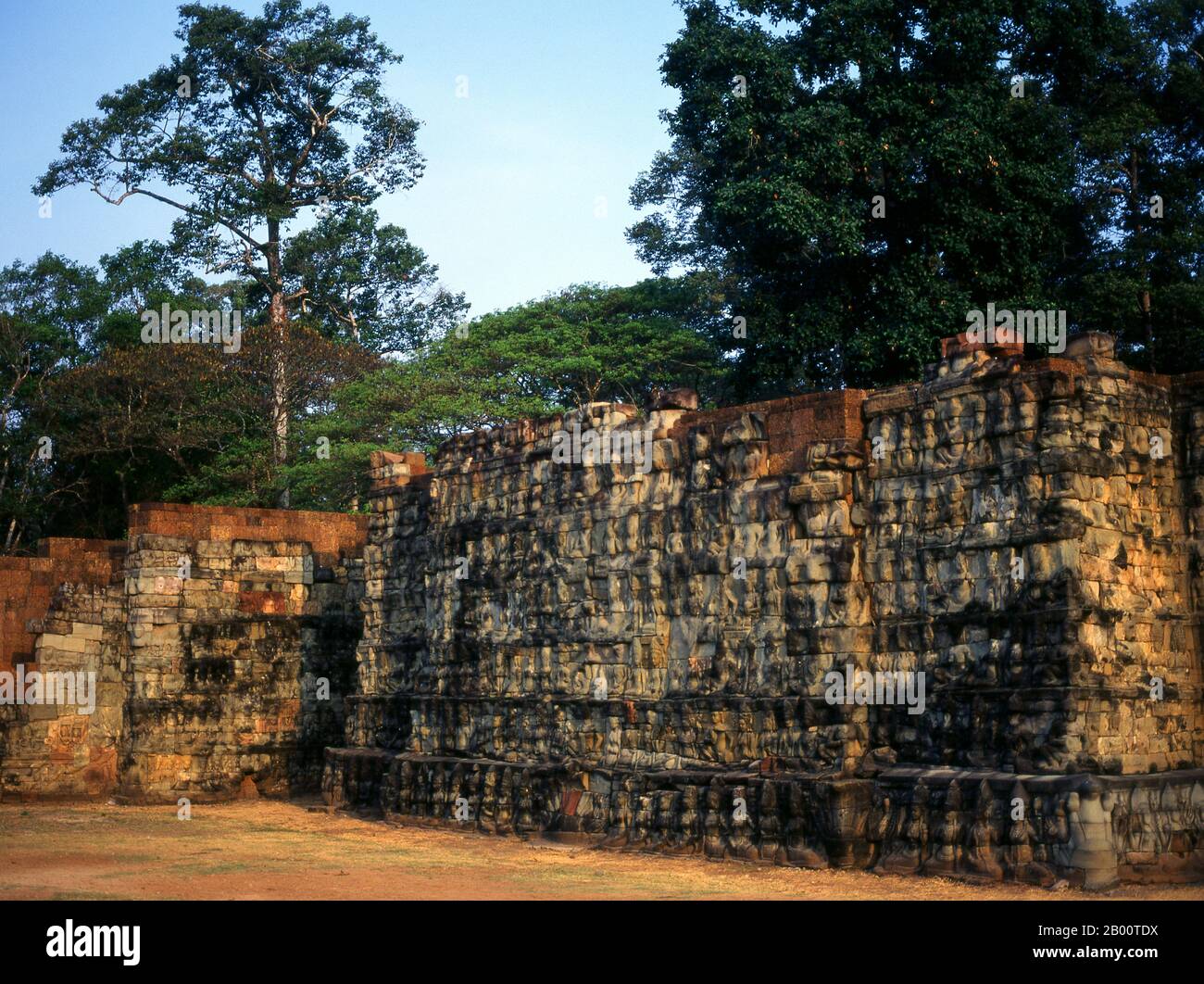 Cambodia: The Terrace of the Leper King, Angkor Thom.  The Terrace of the Leper King was built during the reign of King Jayavarman VII.  Angkor Thom, meaning ‘The Great City’, is located one mile north of Angkor Wat. It was built in the late 12th century by King Jayavarman VII, and covers an area of 9 km², within which are located several monuments from earlier eras as well as those established by Jayavarman and his successors. It is believed to have sustained a population of 80,000-150,000 people. Stock Photo