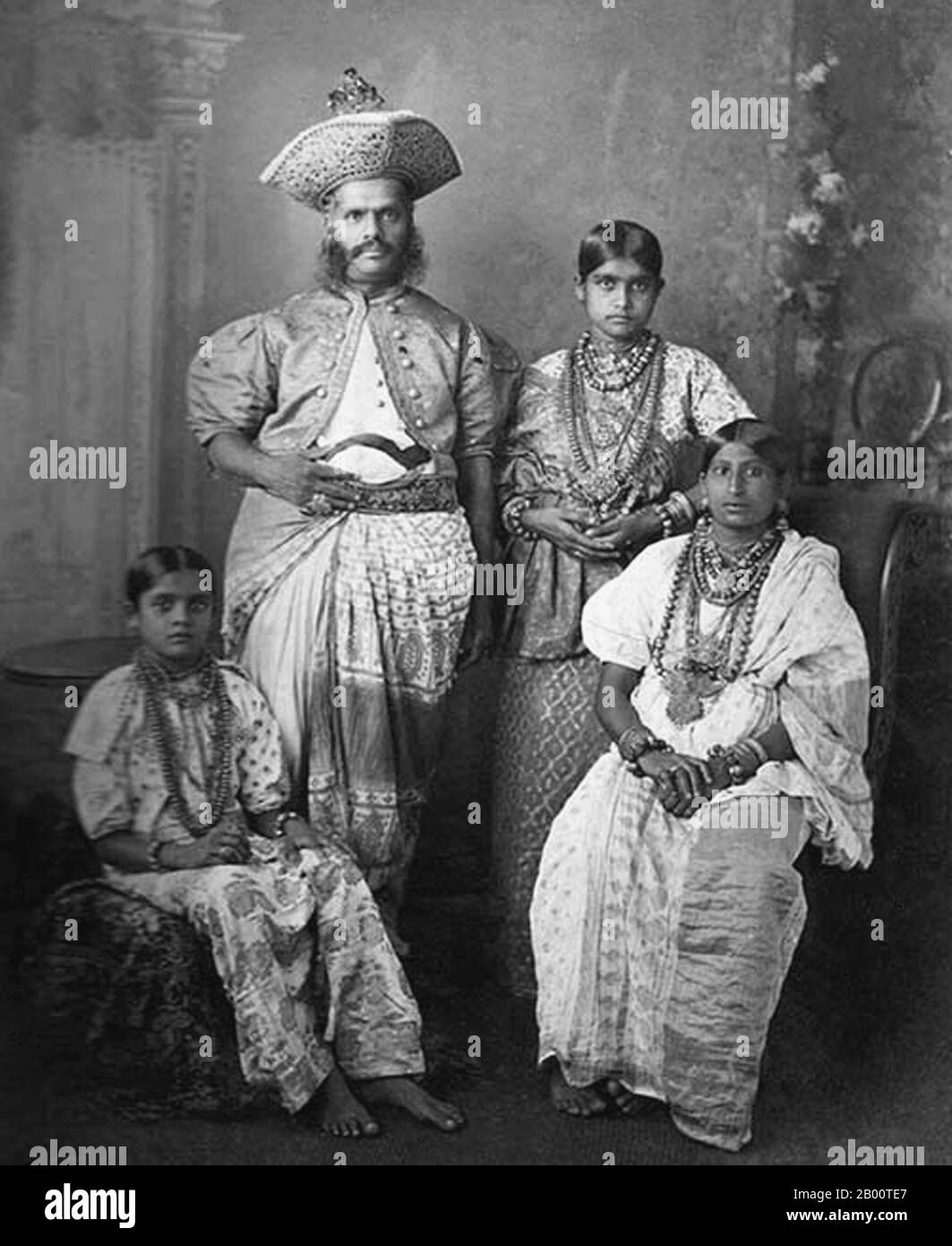 Sri Lanka: Portrait of an aristocratic Sinhalese family from Kandy. Photo by Charles T. Scowen (1852-1948), 1880s.  In 1592 Kandy became the capital city of the last remaining independent kingdom in Sri Lanka after the coastal regions had been conquered by the Portuguese. Kandy stayed independent until the early 19th century. In the Second Kandyan War, the British met no resistance and reached the city on February 10, 1815. On March 2, 1815, a treaty known as the Kandyan Convention was signed between the British and the Radalas (Kandyan aristocrats), which made Kandy a British protectorate. Stock Photo