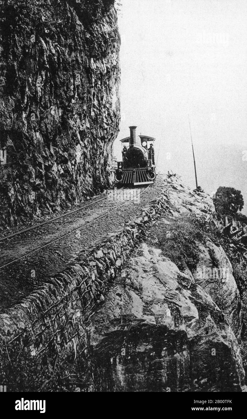 Sri Lanka: Steam locomotive ascending a gradient on the Colombo to Kandy railway. Photo by William Louis Henry Skeen (1847-1903) c. 1900.  Kandy was the last capital of the ancient kings' era of Sri Lanka. The city lies in the middle of the island, formerly known as Ceylon, in the midst of hills in the Kandyan plateau, which crosses an area of tropical plantations, mainly tea. Kandy is one of the most scenic cities in Sri Lanka, and is both an administrative and religious city. It is the capital of the Central Province (which encompasses the districts of Kandy, Matale and Nuwara Eliya). Stock Photo
