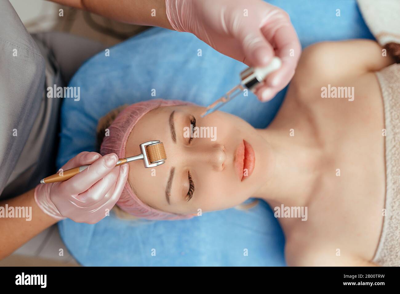 Beautiful girl woman in spa salon,facial rejuvenation procedure.Visit a beautician.Hyaluronic acid rejuvenation beauty injections mesotherapy.Concept Stock Photo