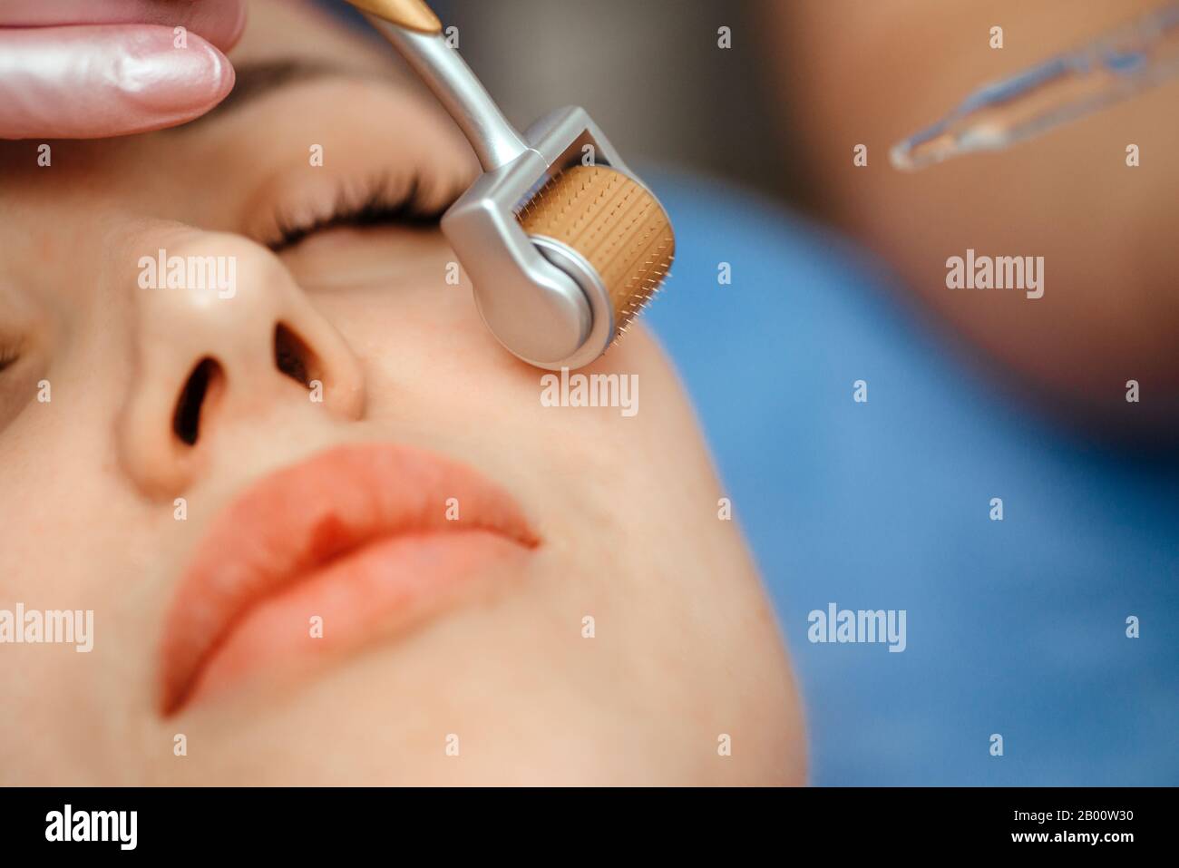 Beautiful girl woman in spa salon,facial rejuvenation procedure.Visit a beautician.Hyaluronic acid rejuvenation beauty injections mesotherapy.Concept Stock Photo