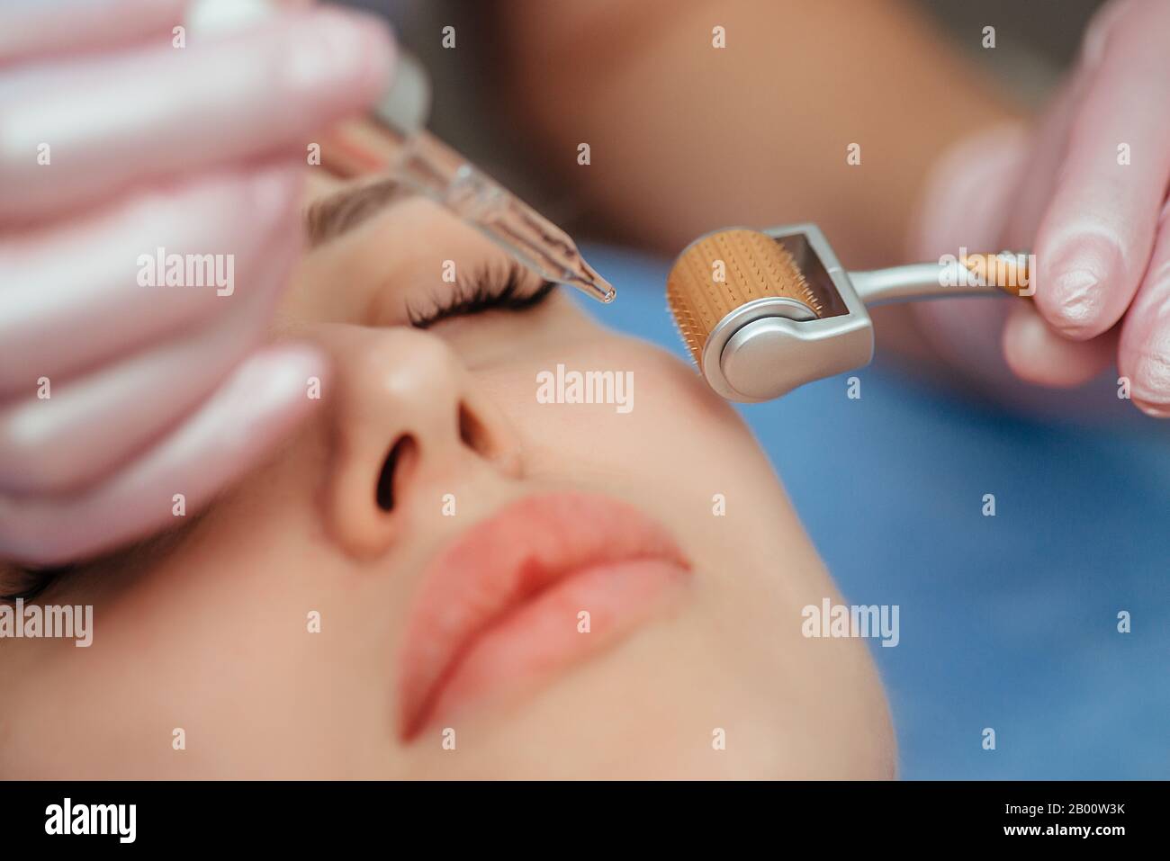 Beautiful girl woman in spa salon,facial rejuvenation procedure.Visit a beautician.Hyaluronic acid rejuvenation beauty injections mesotherapy.Concept Stock Photo