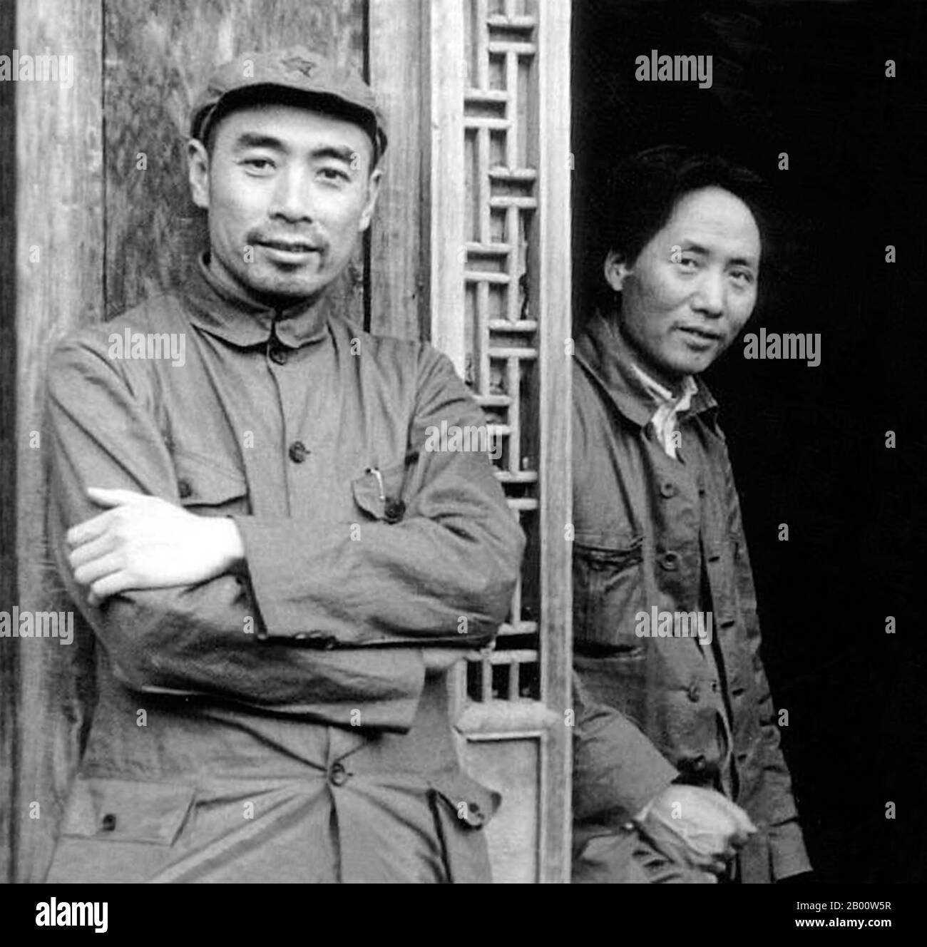 China: Relaxed Zhou Enlai (left) and Mao Zedong at the Chinese Communist capital of Yan'an, c. 1936. Photograph by US journalist Edgar Snow.  Mao Zedong, also transliterated as Mao Tse-tung (26 December 1893 – 9 September 1976), was a Chinese communist revolutionary, guerrilla warfare strategist, author, political theorist, and leader of the Chinese Revolution. Commonly referred to as Chairman Mao, he was the architect of the People's Republic of China (PRC) from its establishment in 1949, and held authoritarian control over the nation until his death in 1976. Stock Photo