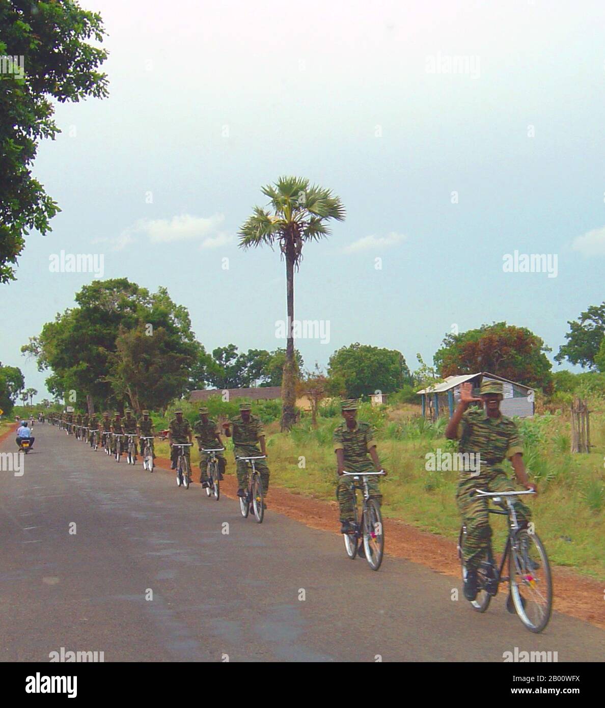Sri Lanka: A Tamil Tiger (LTTE) bicycle platoon near Kilinochchi, May 2004. Photo by Qz10 (CC BY-SA 3.0 License).  The Sri Lankan Civil War began on July 23, 1983, and quickly developed into an on-and-off insurgency against the Colombo government by the Liberation Tigers of Tamil Eelam (LTTE), commonly known as the Tamil Tigers, and other few rebel groups, which were fighting to create an independent Tamil state named Tamil Eelam in the north and the east of the island. After a 26-year military campaign, the Sri Lankan military defeated the Tamil Tigers in May 2009. Stock Photo