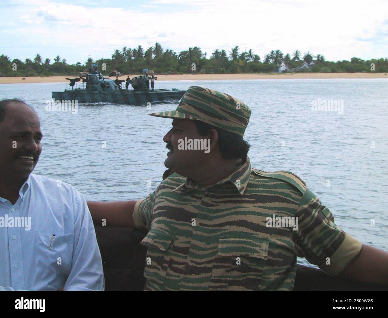 Sri Lanka: Colonel Soosai, head of the LTTE Sea Tigers, on a fast attack craft at Mullaitivu, 2003.  Thillaiyampalam Sivanesan (October 16, 1963  - May 18, 2009), also known by his nom de guerre, Colonel Soosai, was the head of the Sea Tigers, the naval wing of the Liberation Tigers of Tamil Eelam. He was killed by the Sri Lankan Army on May 18, 2009. Image taken by Isak Berntsen and released into the Public Domain. Stock Photo